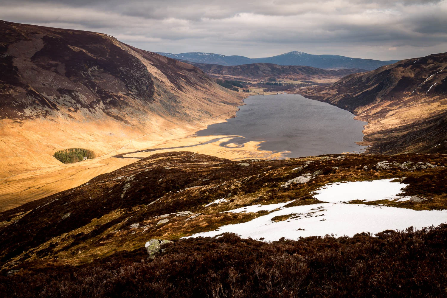 Snow patches on the Shank of Inchgrundle looking toward Loch Lee.