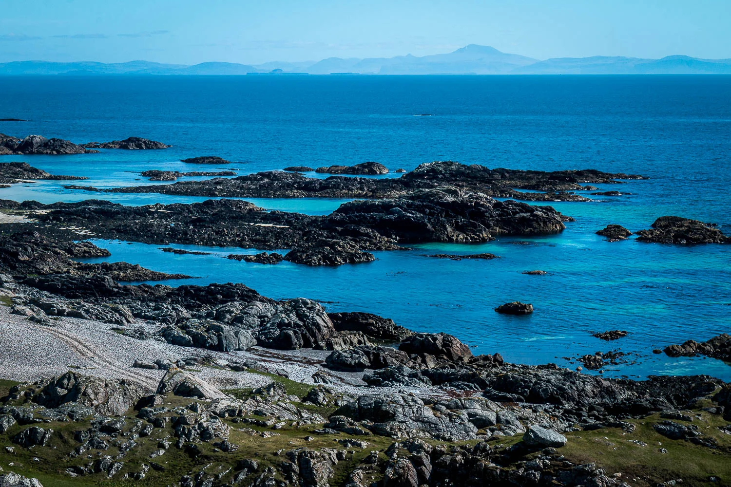 Looking east from Cleit Mhor, the Treshnish Isles and Ben More on Mull in the horizon.