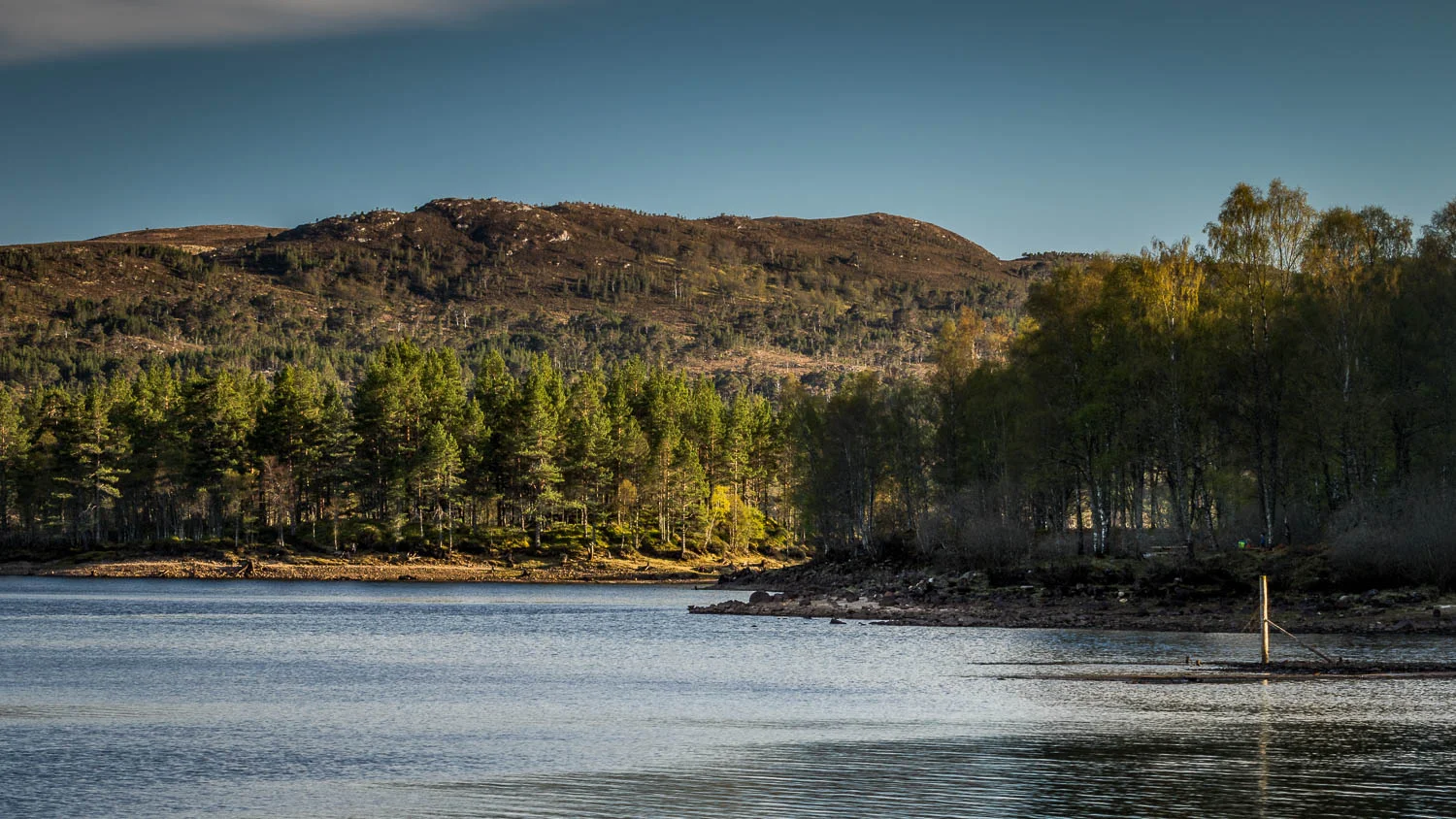 The fading sunlight from the shores of Loch Beinn A' Mheadhoin.