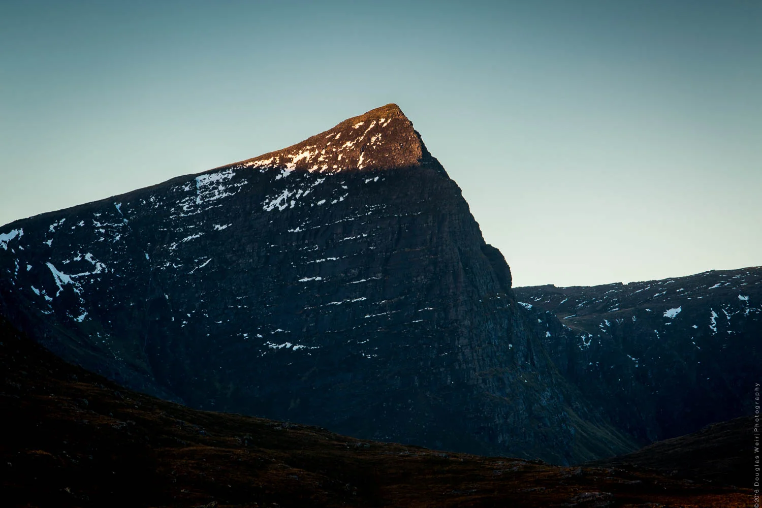 The unmistakable peak of Sgurr Fhidhleir lit by the morning sun.