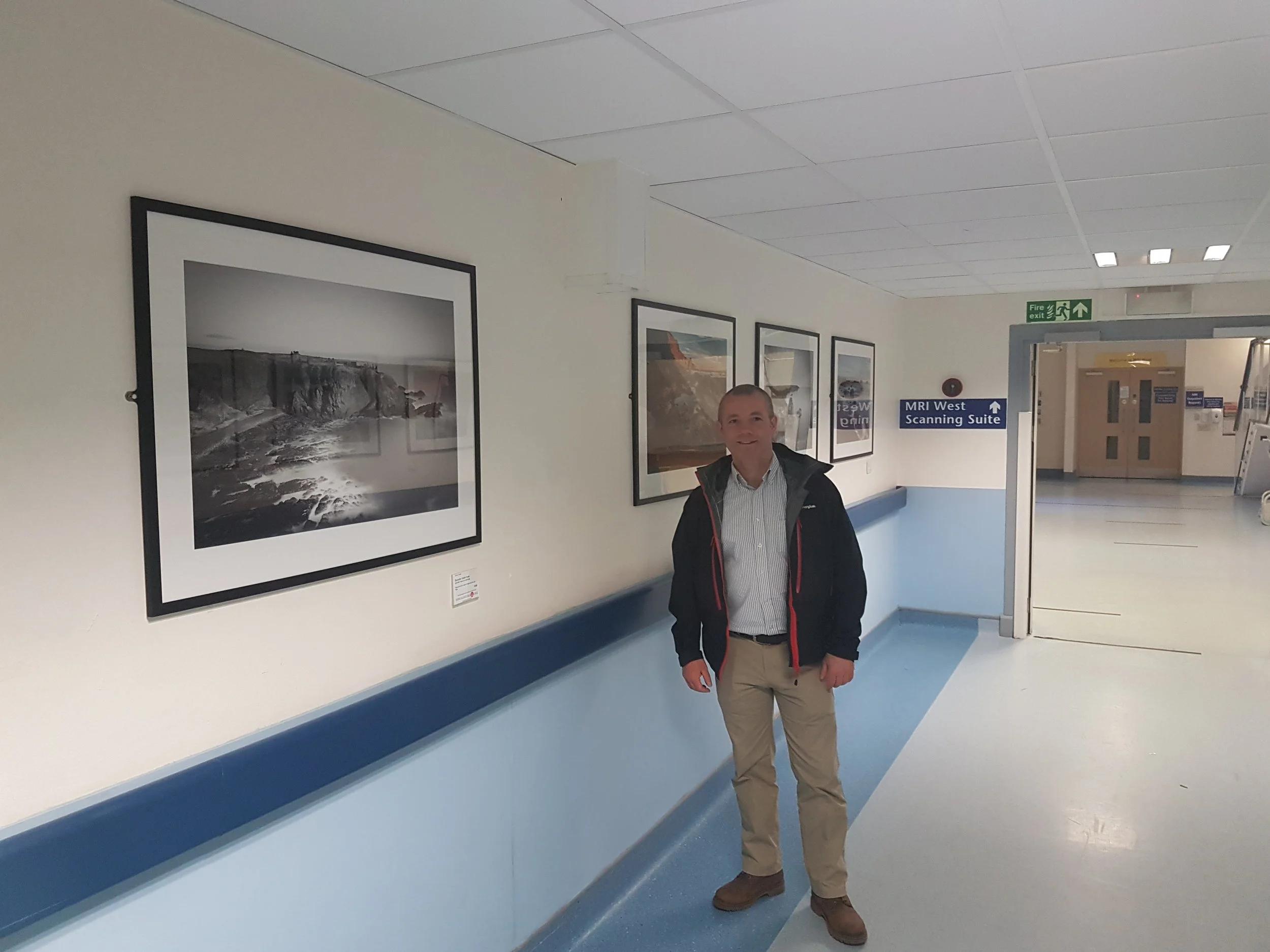 Jason standing in beside his image of Dunnottar Castle