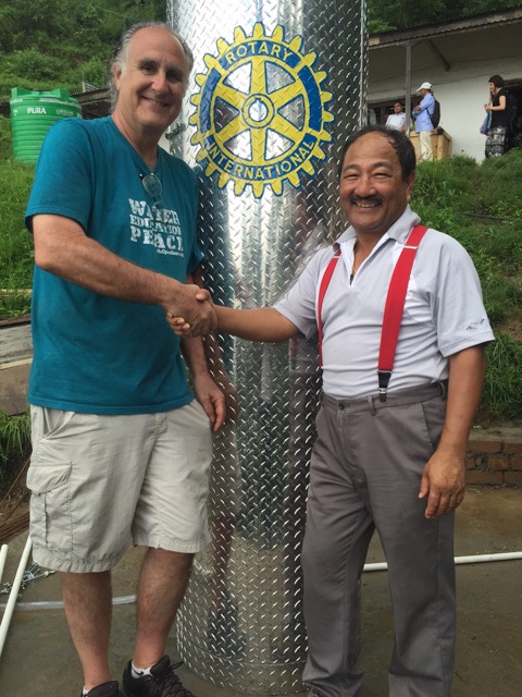 Jon Kaufman (left) and Narayan Shrestha celebrate new water filter