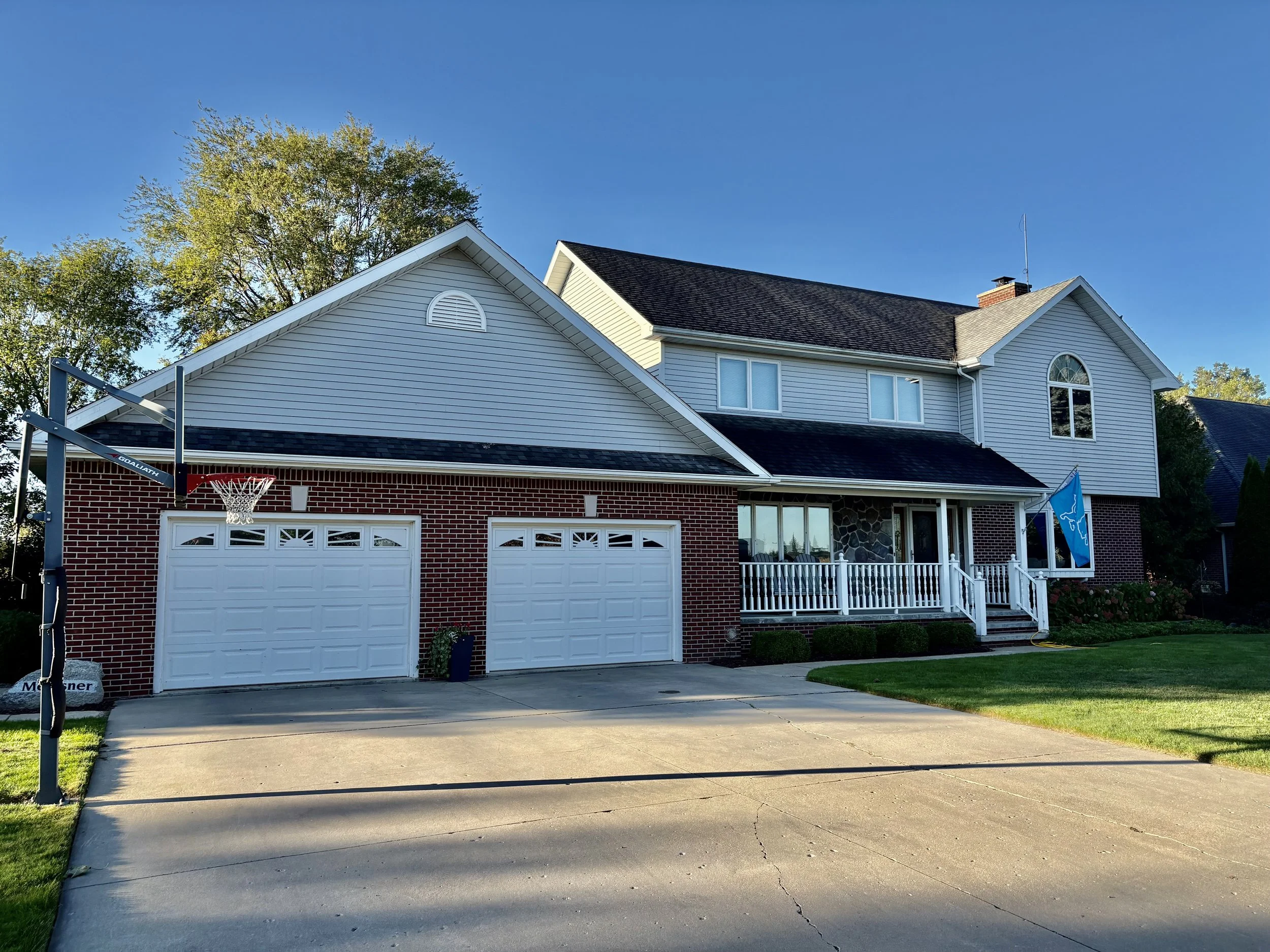 Spacious, beautifully updated two-story home with a finished lower level, heated garage.
