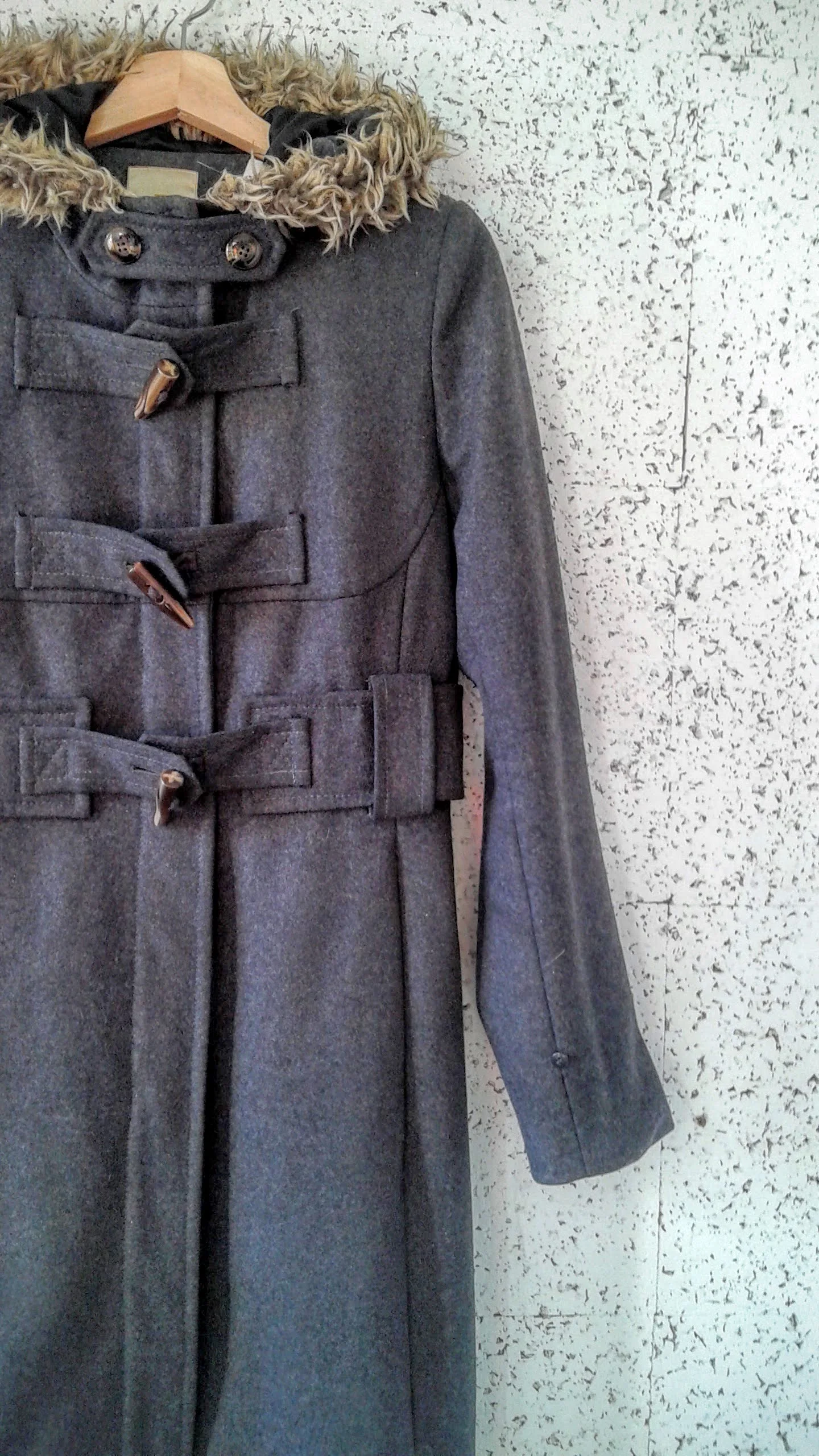 (Who was looking closely? This coat was peeking out from the backroom last week!)