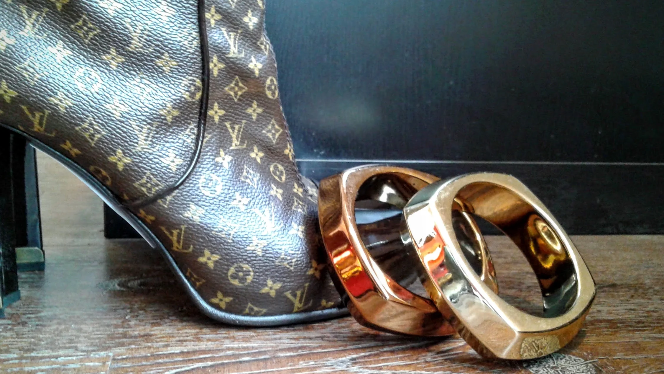 Bracelets, $12 each; Louis Vuitton boots, S7.5 $750