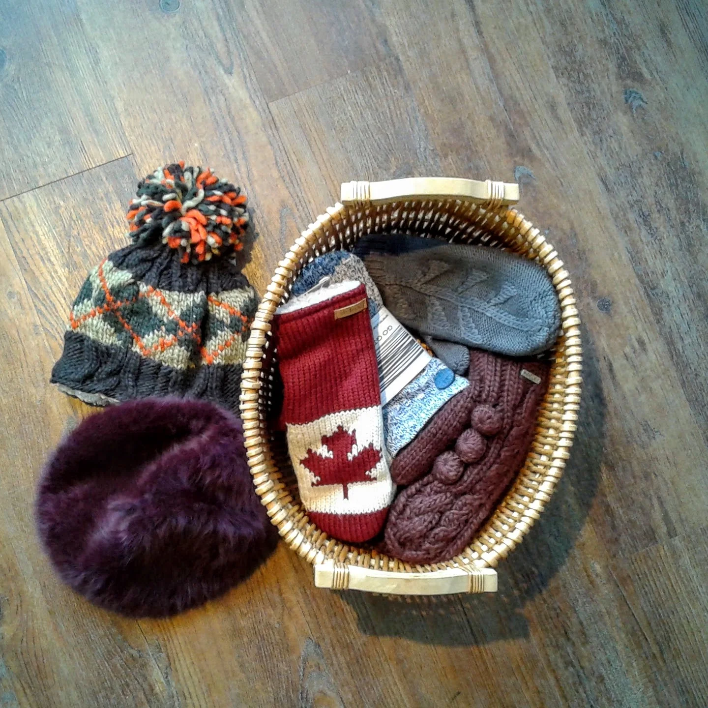 DeLux tuque, $24; Ralph Lauren beret, $24; Blue DeLux mittens $20; Brown DeLux mittens, $18; Maple leaf DeLux mittens, $24; Go Gidget Go mittens, $30