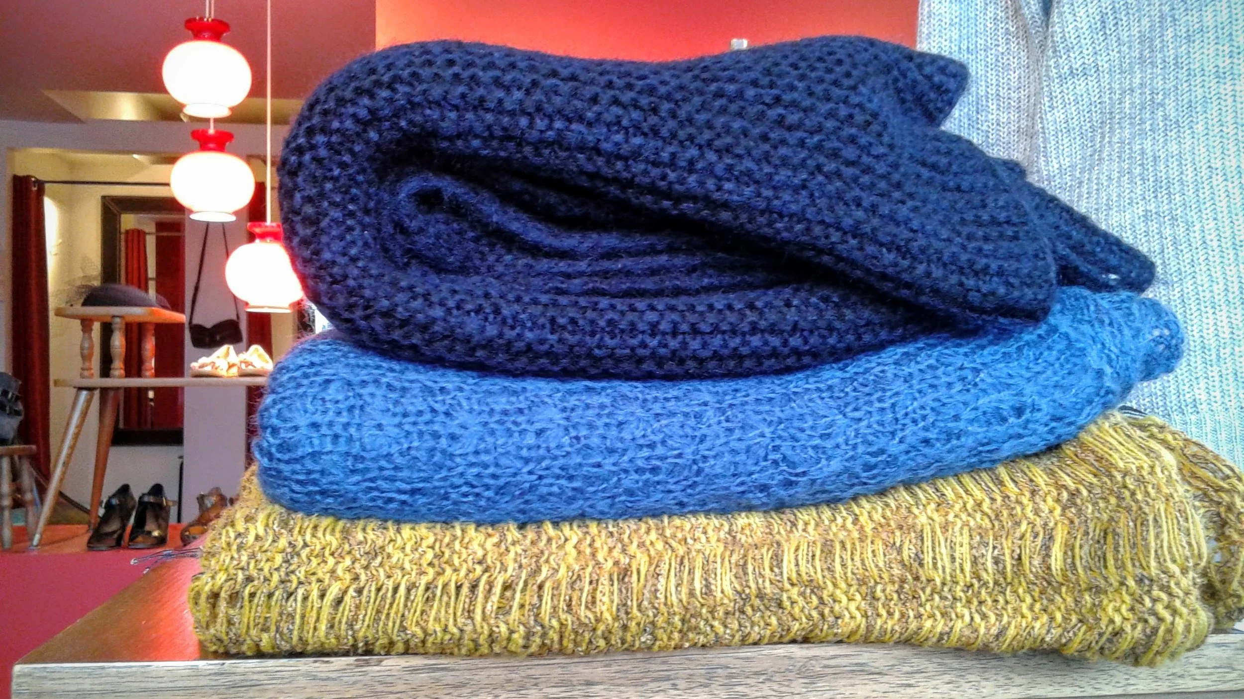 Black Zara scarf, $22; blue Delux infinity scarf, $20; yellow buttoned scarf, $28