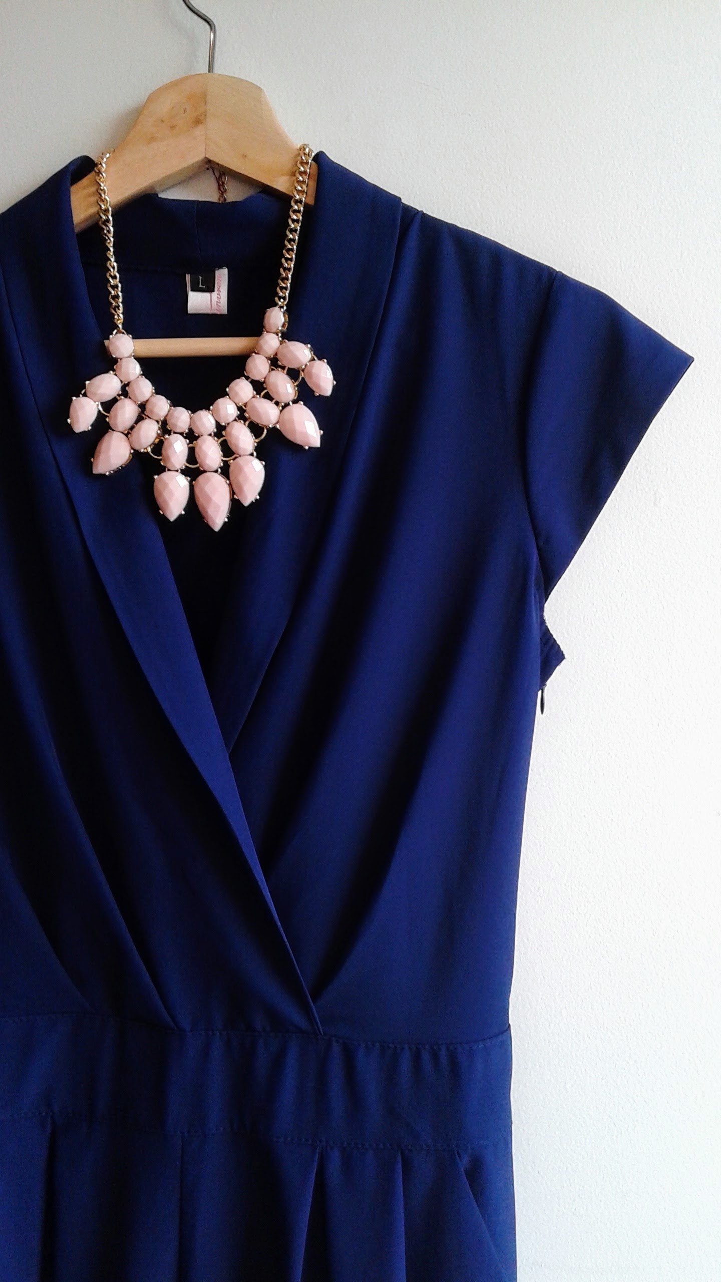 Jump suit; Size L, $36. Necklace, $28