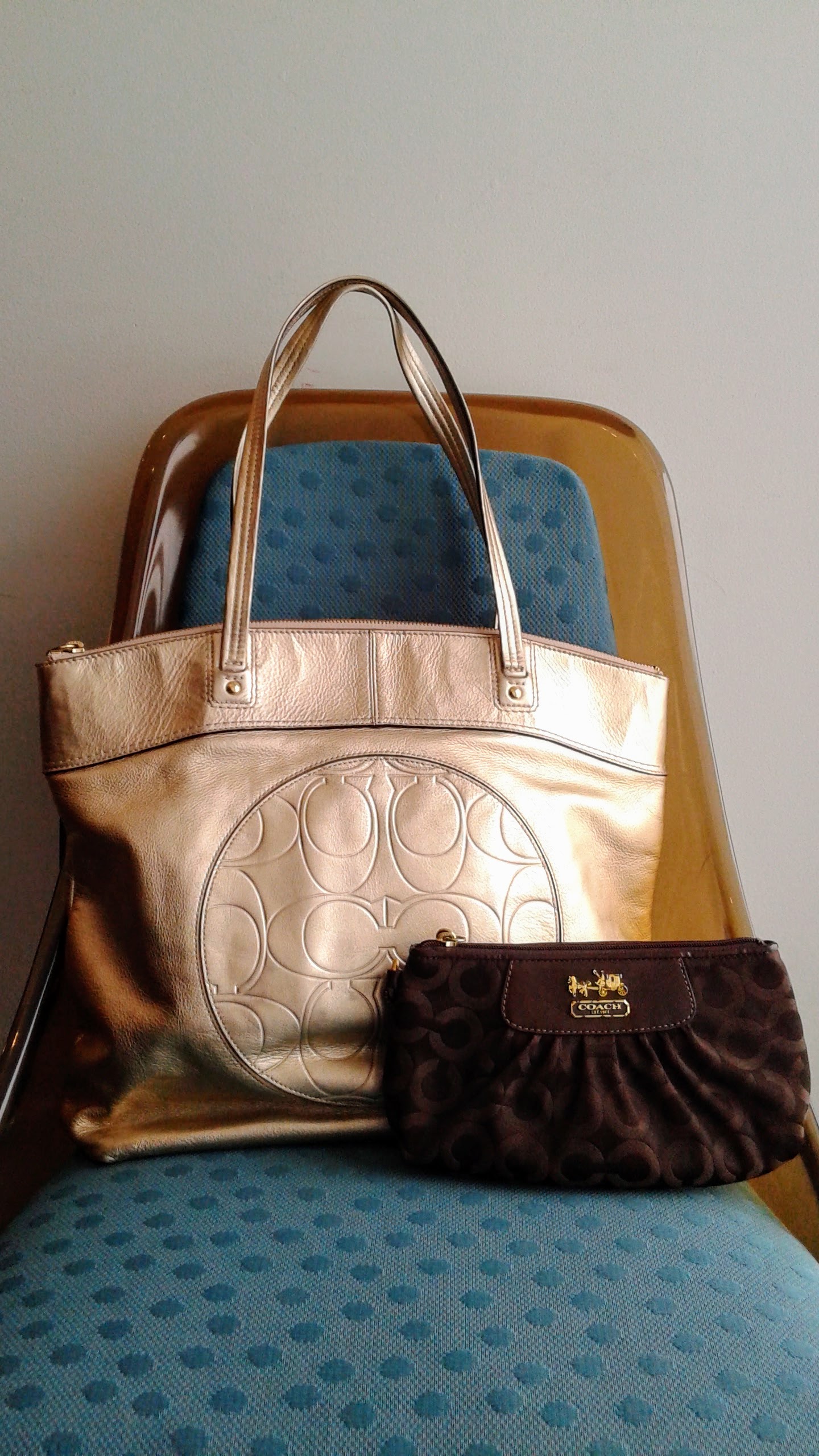 Coach tote, $62; Coach clutch, $42
