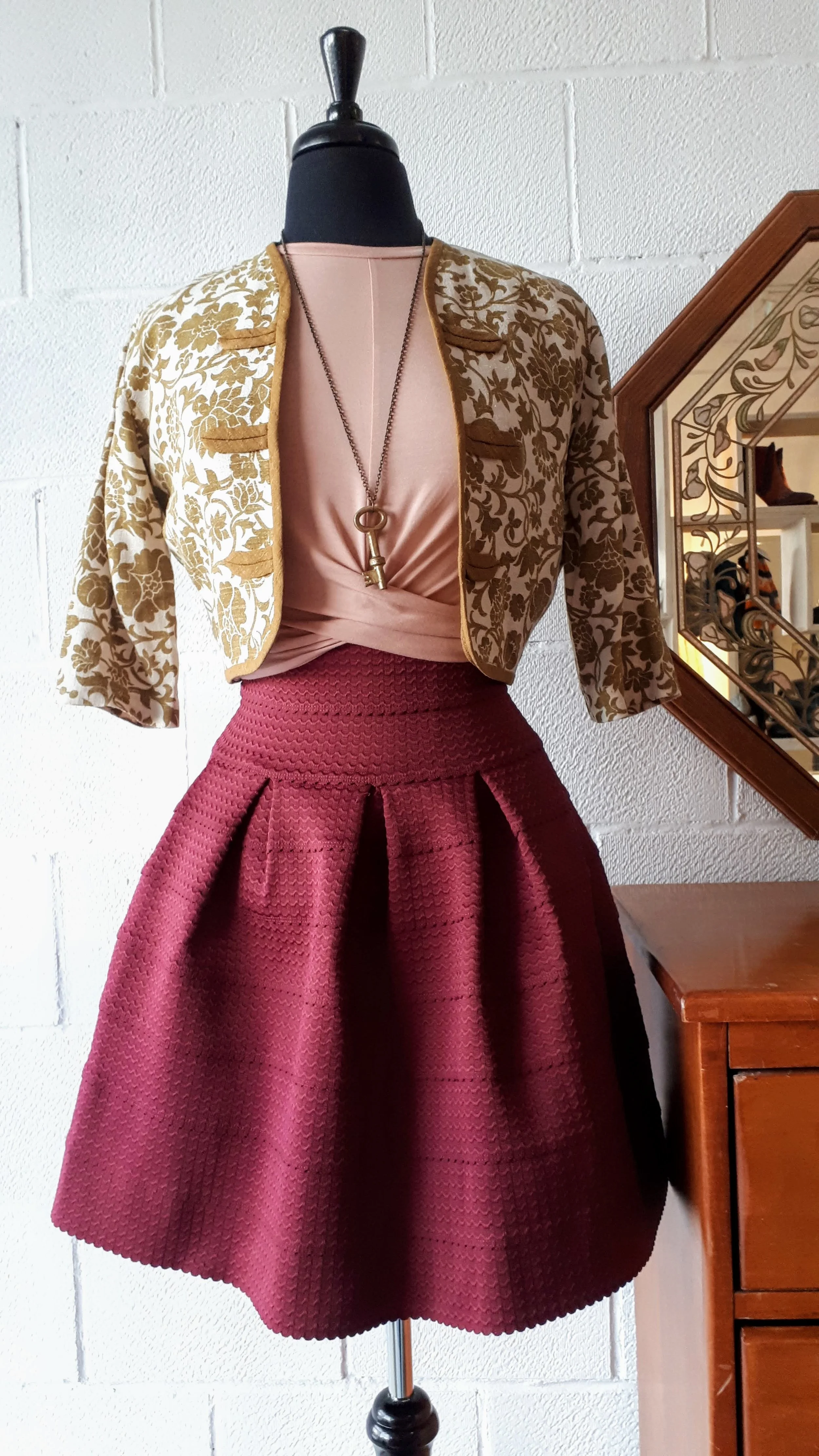Girl From Savoy skirt; Size XS, $28. Matinée of Canada top; Size S, $24. Necklace, $22