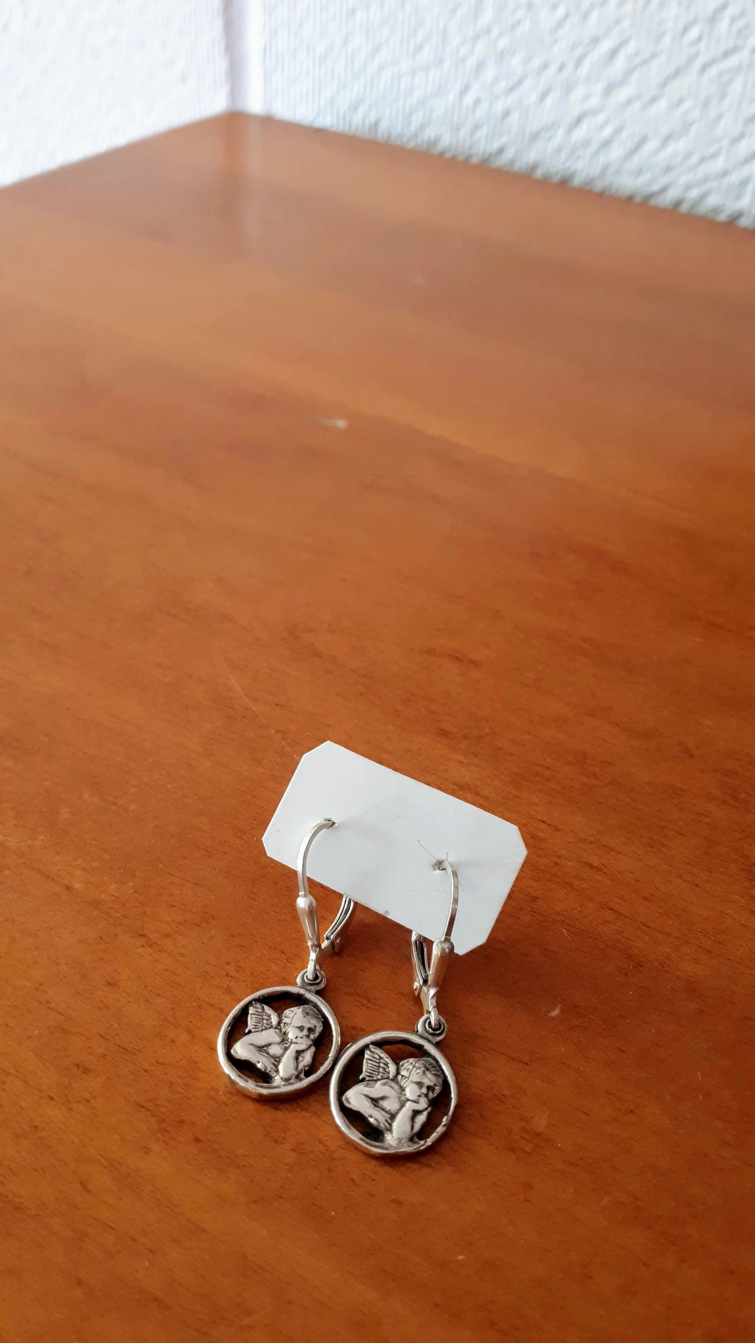 Cupid earrings, $20