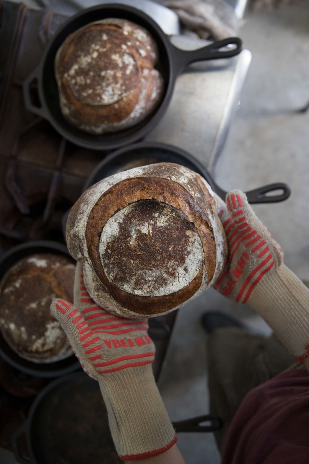 Jimena-Peck-Denver-Lifestyle-Editorial-Photographer-Daniel-Gray’s-Sourdough-Bread-Gloves-Holding-Bread