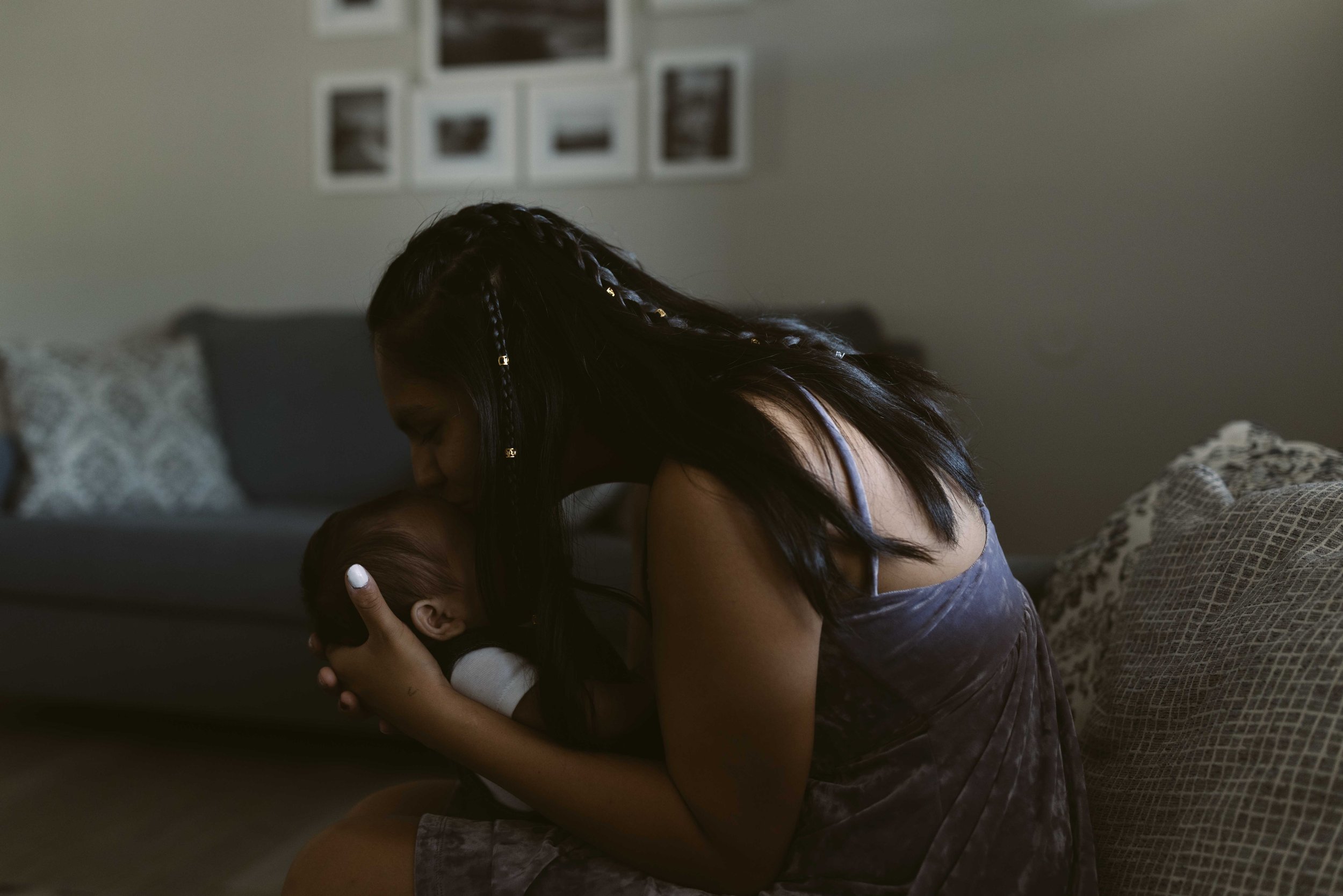  Arvada, Colorado - July 15, 2022: After finding out she was pregnant again,  LaTavia had to find help and a home fort her, her daughter Amidala and her baby on the way. Hope House provided them with a roof and lots of support. LaTavia holds her baby