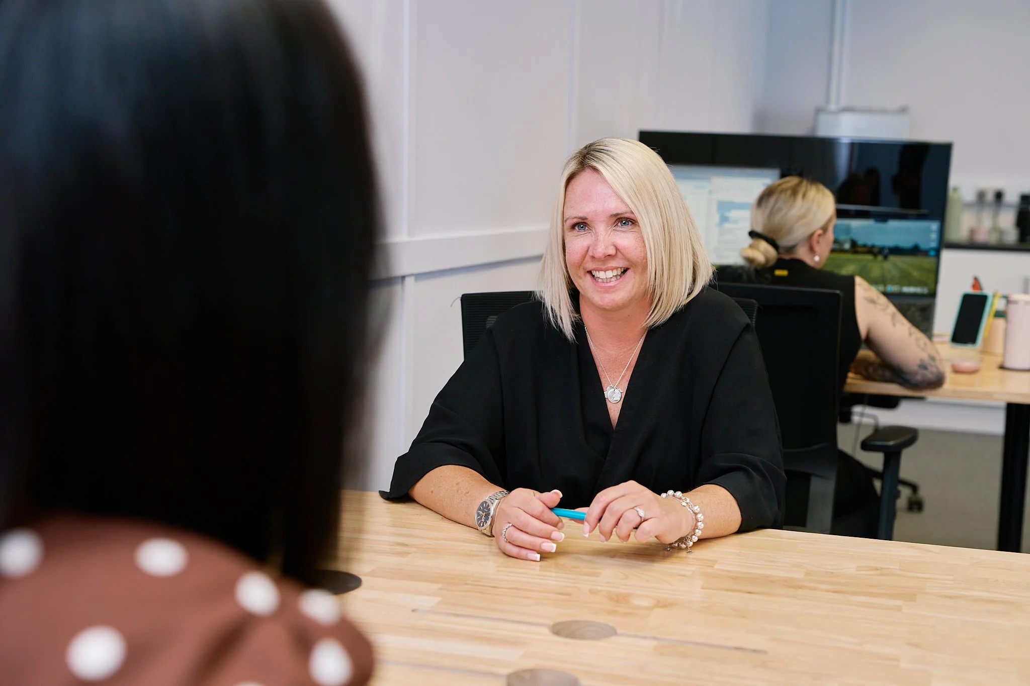 Harwood HR Solutions colleagues collaborating during a meeting at their Oxfordshire office.