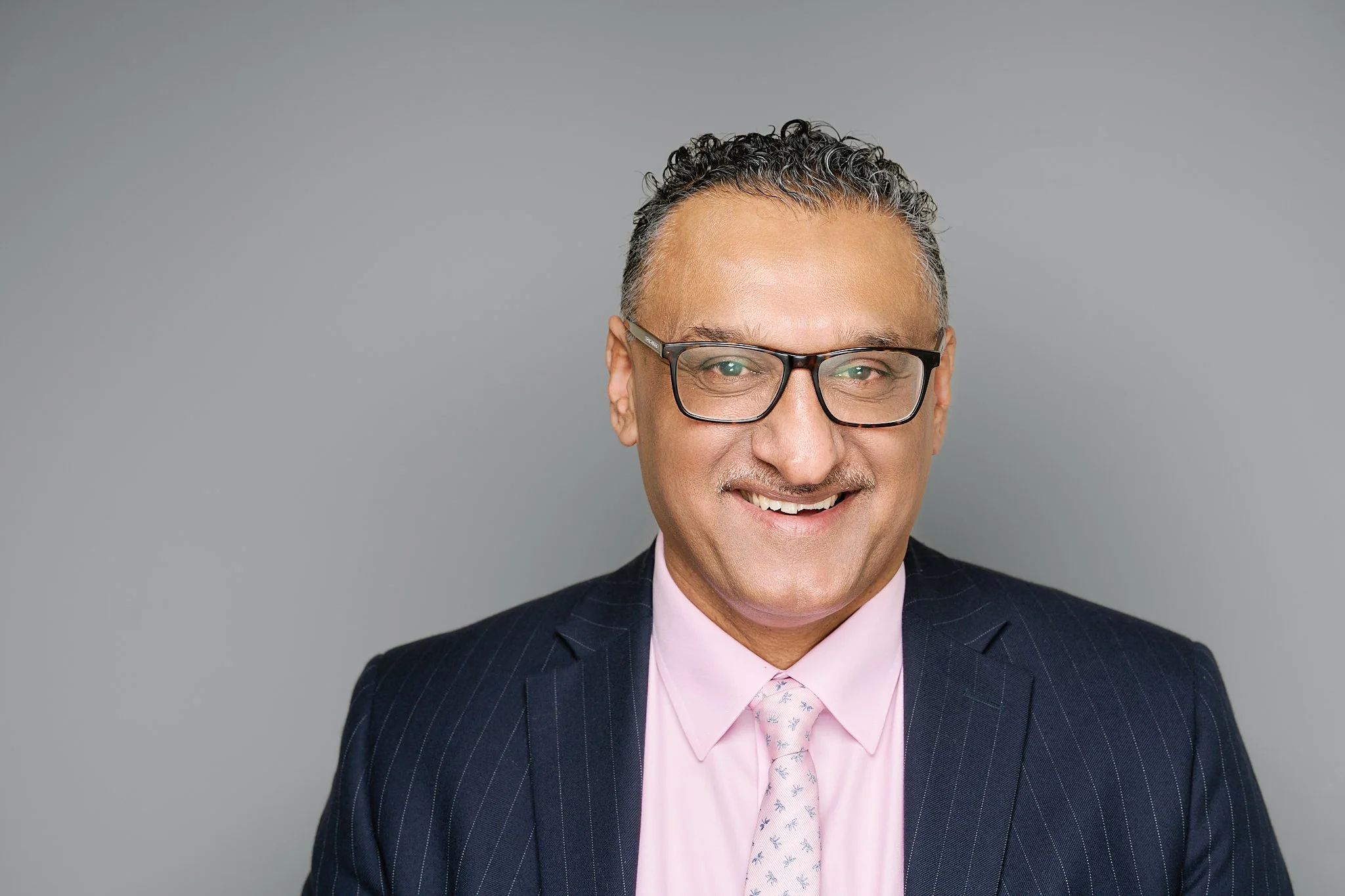 Professional male solicitor headshot taken in Leicester for Welford Solicitors, showcasing consistent corporate branding photography for a local law firm.