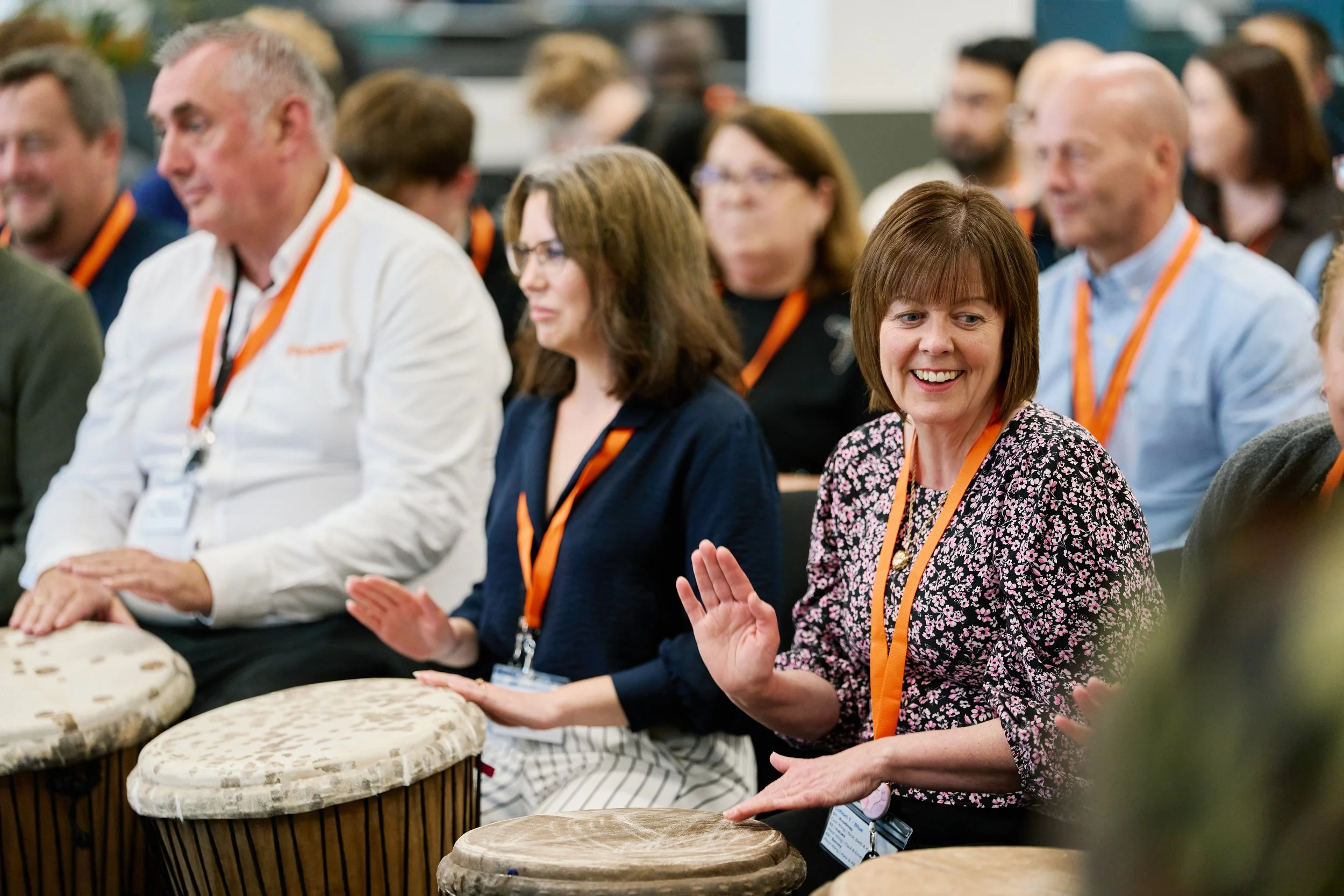 Employees taking part in a Jinbari drumming team-building activity at FireAngel