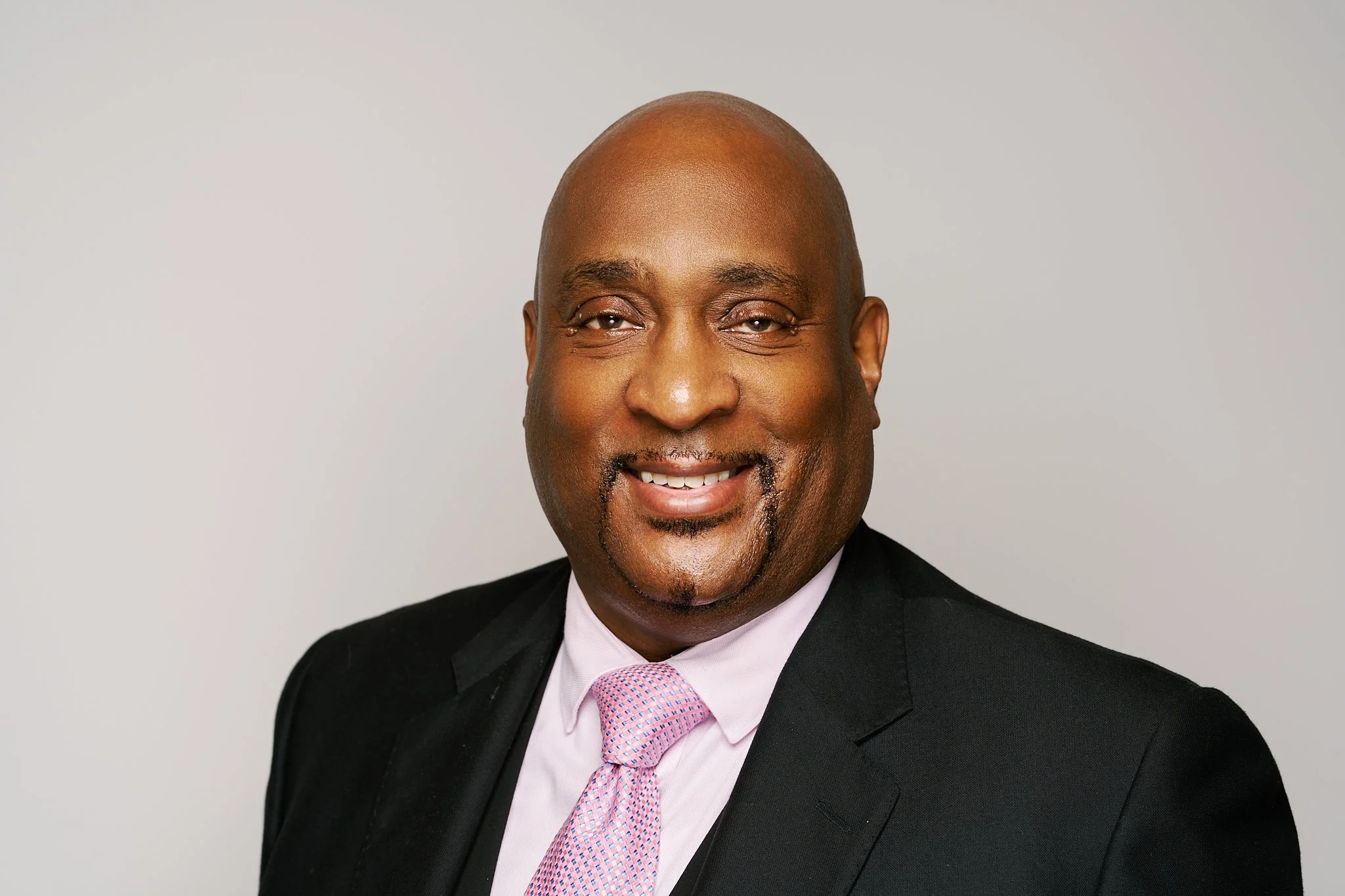 Professional business portrait for LinkedIn and company website.