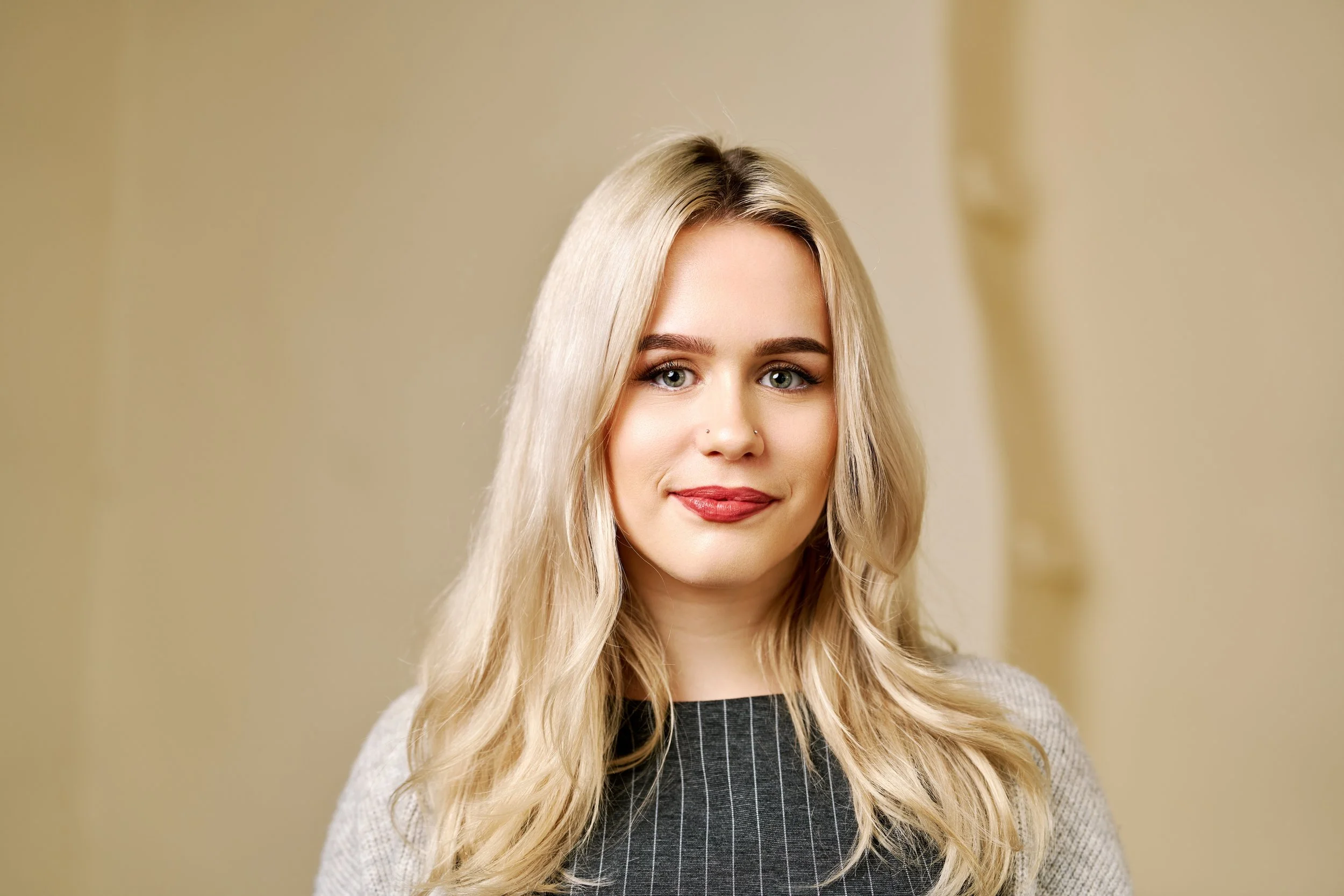 Behind-the-scenes view of a professional headshot photography session creating relaxed, natural portraits