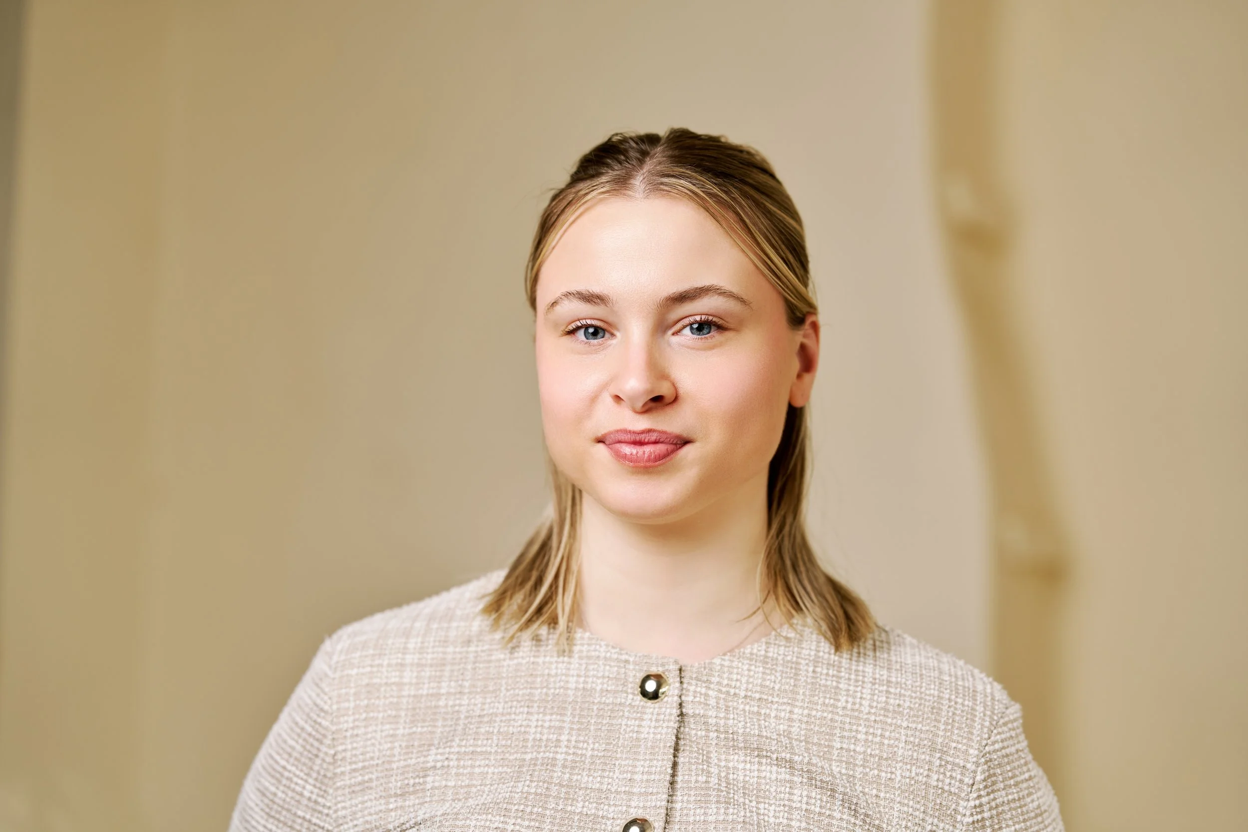 Professional headshot of a business professional with natural lighting, suitable for LinkedIn and corporate profiles