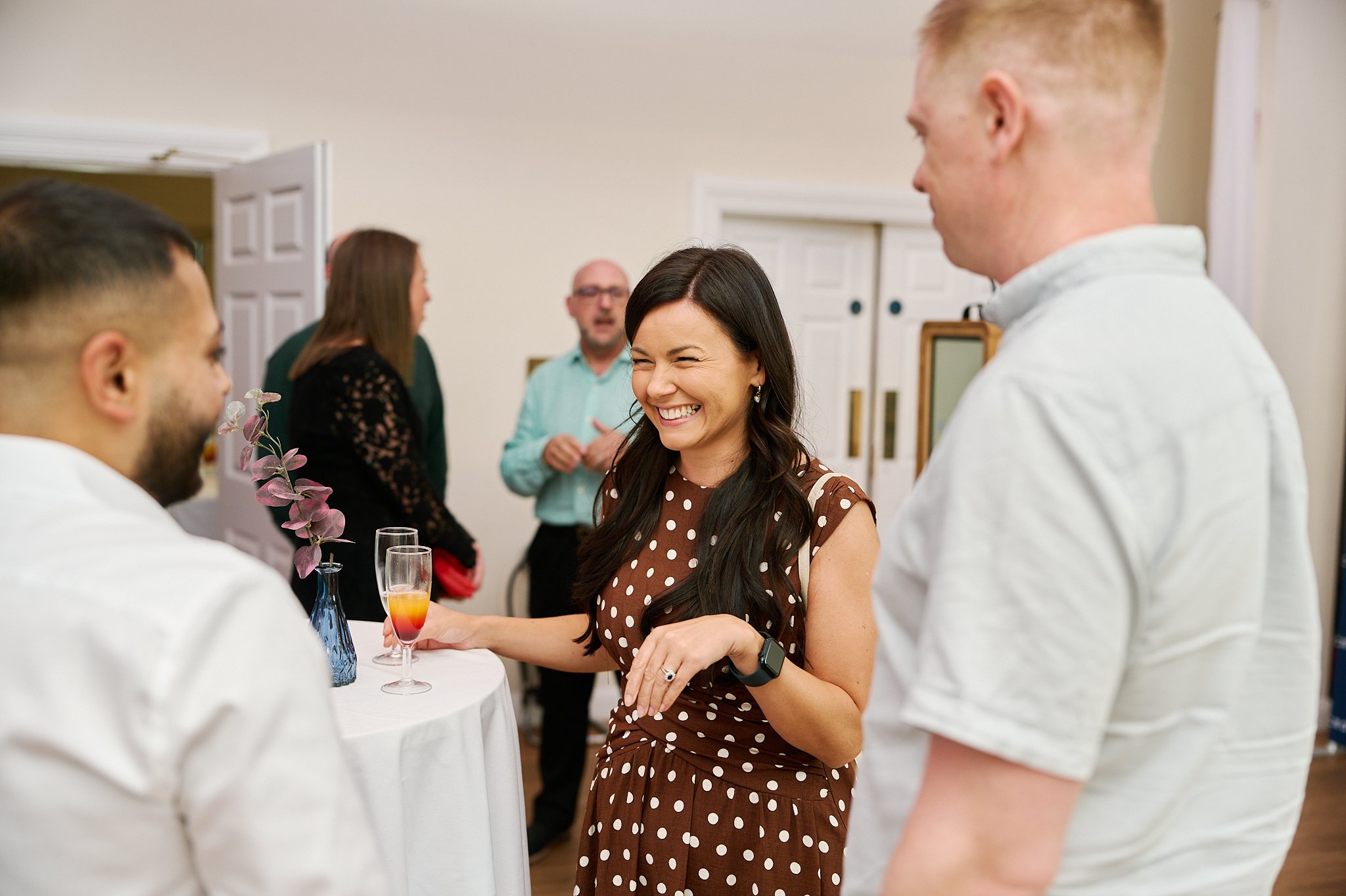 Business guests networking at Microtech’s 40th anniversary party at Winstanley House.