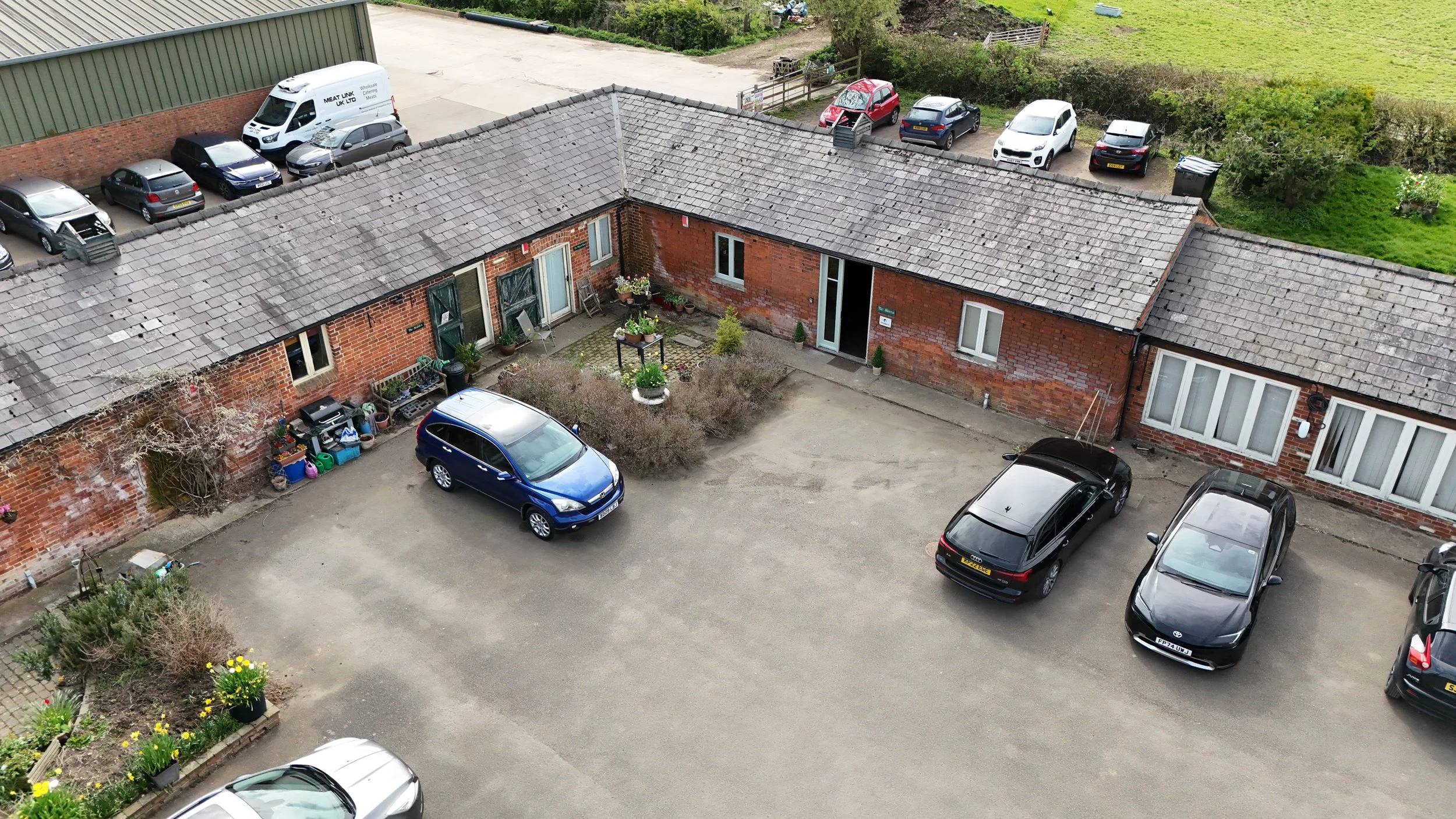 Aerial drone view of over 50s gym in Market Harborough showing rural converted farm location