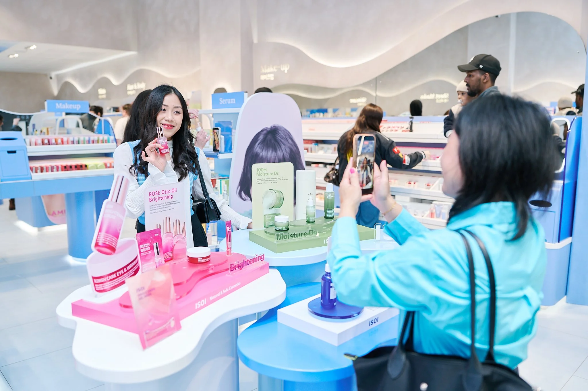 Influencers testing skincare products during the Pureseoul Leicester store launch event