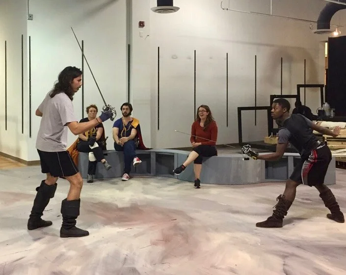 Hatcher (right) rehearses his duel with Athos - played by Steven Sullivan - as Fight Director Alexis Black (center) looks on. 