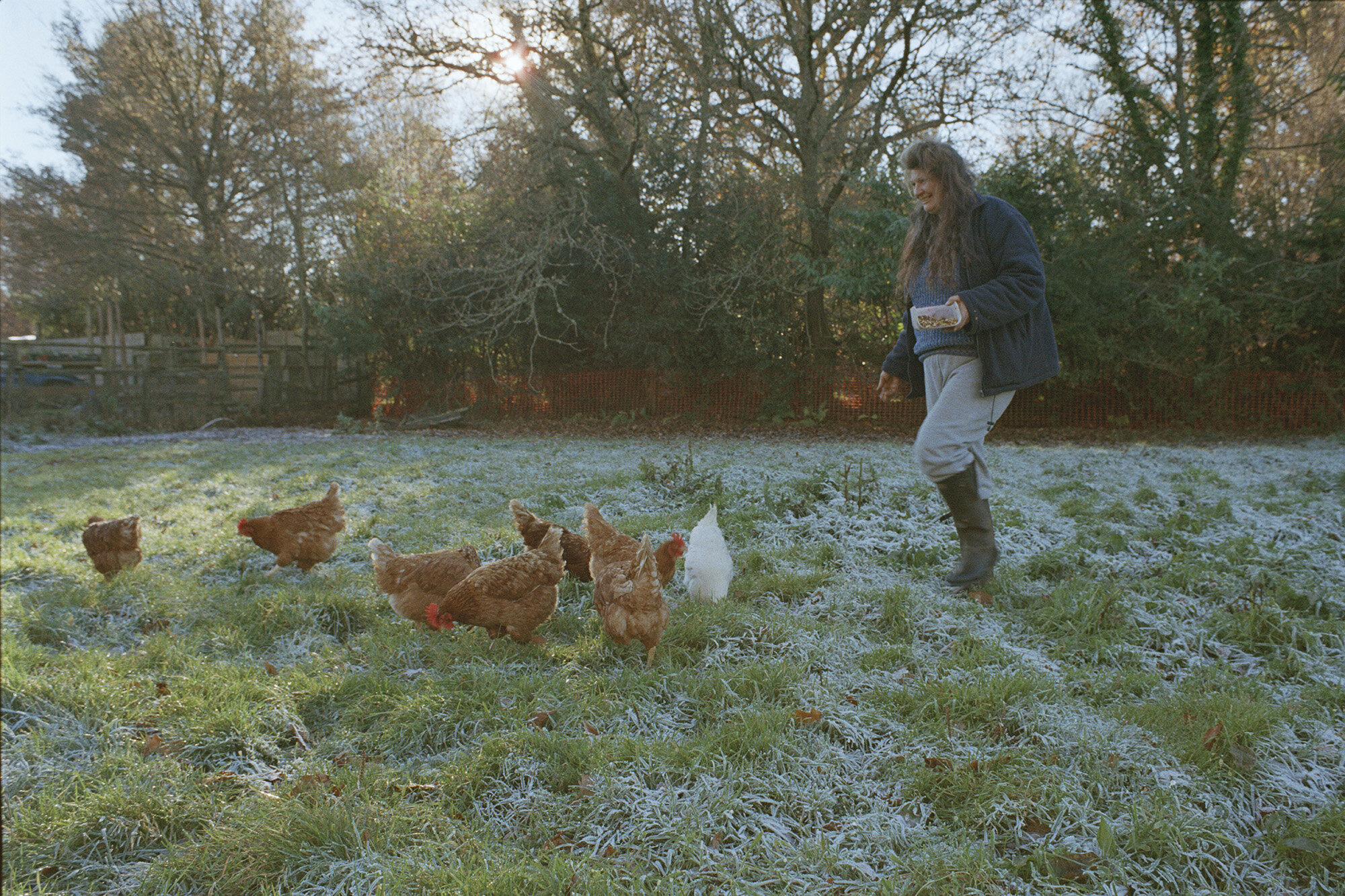 Corinne Whitehouse07_Anita_feeding the chickens.jpg