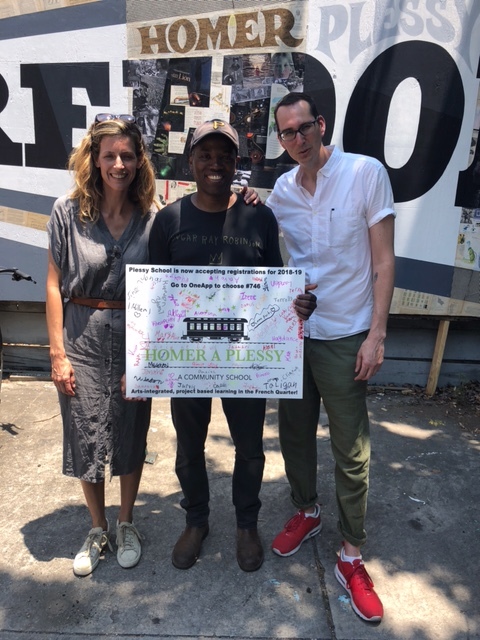 Erin and Jon with Cey at the mural unveiling, with thank you card from Plessy students, May 15, 2018.