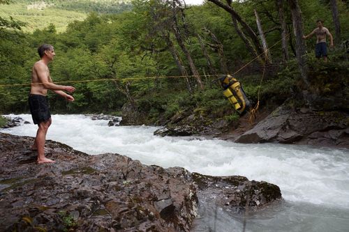 Ferrying the packs across the Aviles Sur after swimming across on the morning of day two. Photo: Rick Ridgeway