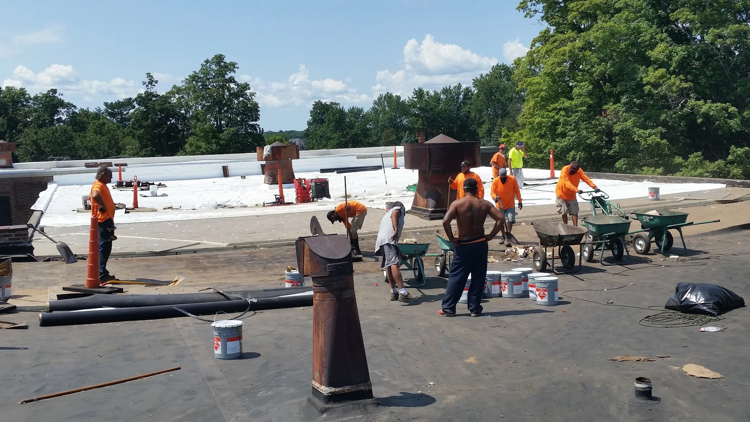Roofing crew working hard to replace our roof. They're almost half done already!