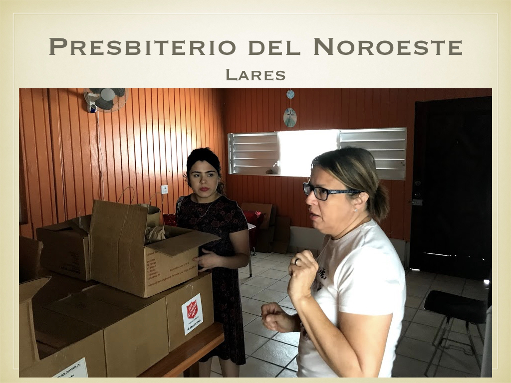 Pastor Evelyn shows us the boxes of food from aid agencies and describes how the church facilitated the distribution to their community. For those unable to collect the supplies from the church themselves, church and community volunteers (many of them elderly women) hand-delivered the boxes and water - often on foot, due to the ongoing inaccessibility of roads in some areas.