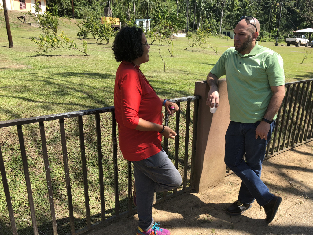 Amaury speaks with the director of the camp. The debris was so thick after the storm that it took her 5 days to clear the 500 feet to the end of her driveway to reach the road and the outside world.