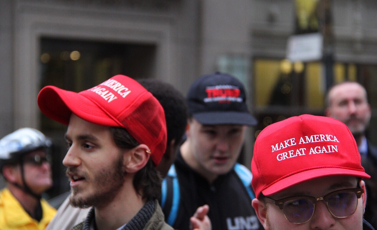 A small group of Trump supporters were among the sea of Anti-Trump protestors on Saturday, with some sporting Trump’s iconic red hat.