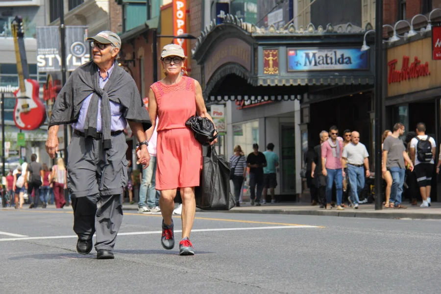 Malcolm Alexandroff and Marlene Fine walk hand-in-hand while enjoying Open Streets Toronto Sunday.