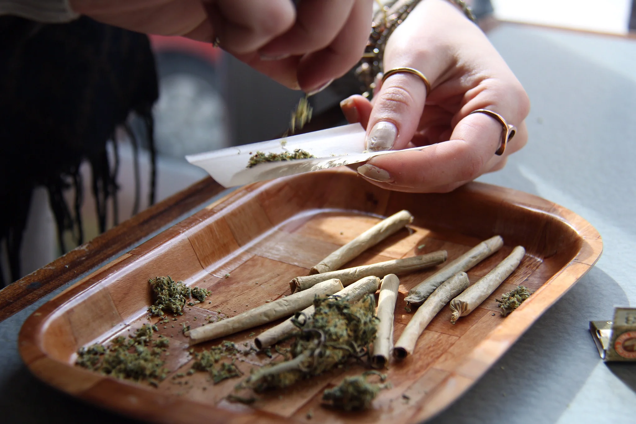 An employee at Cannabis Culture’s Church Street location, prepares a joint on Mar. 8, 2017.