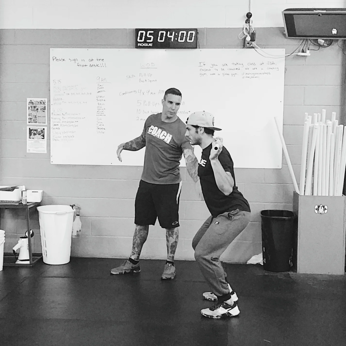 JSA CrossFit's coaches Brody and Dave demonstrating proper form while explaining the WOD (workout of the day). JSA CrossFit is in Manasquan, NJ.