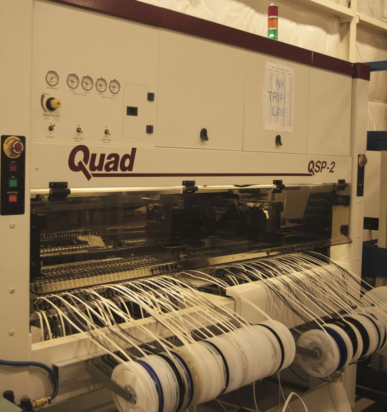 Digital boards being pressed in one of the manufacturing plant’s computerized lines. 