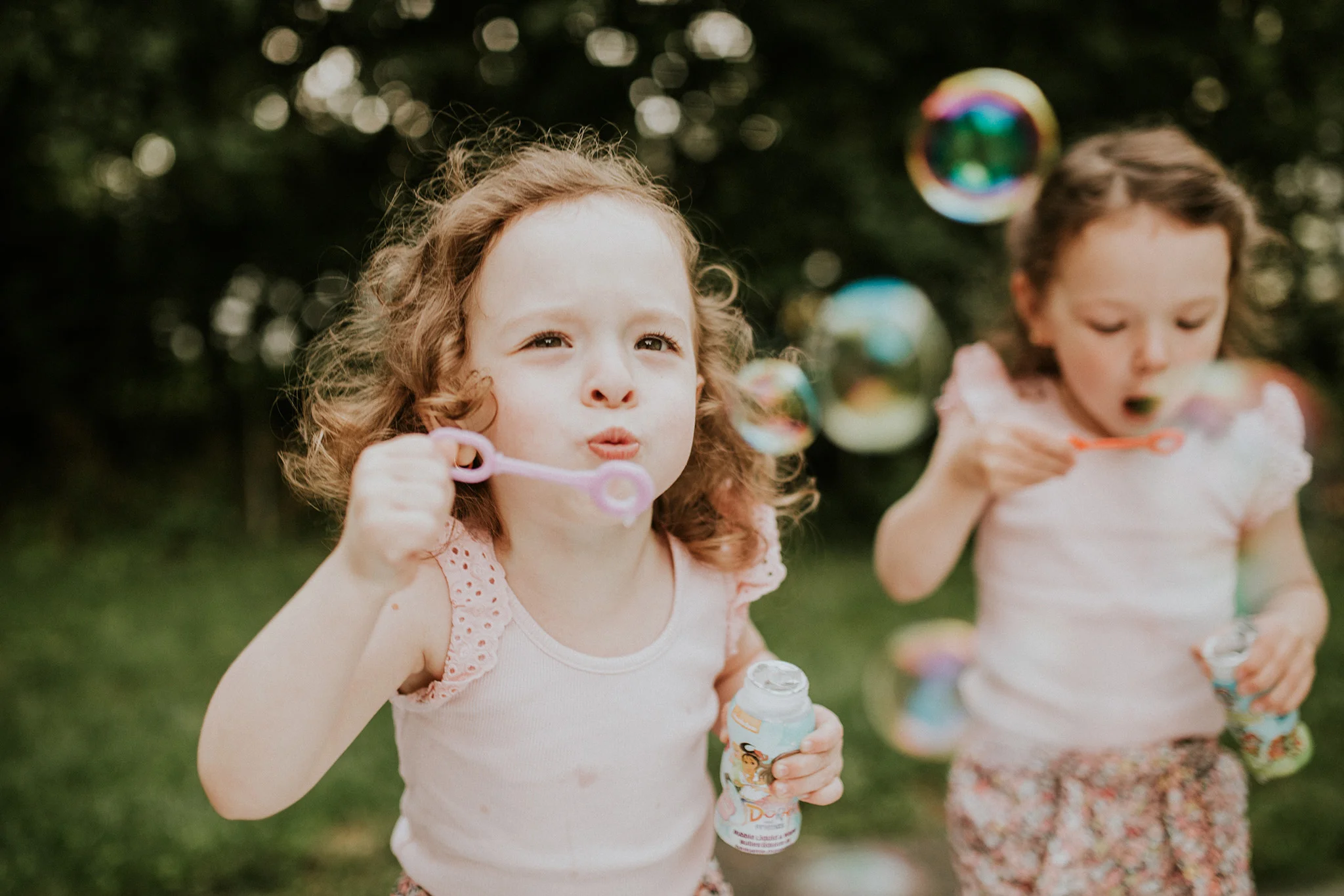 August 11: Dinner guests and bubbles and our backyard. Olivia and Emma's mom referred me my job at Connecticut Children's . We'd become friends through the process of engagement, wedding and family photos over the course of the last few years, and when she heard the photographer position had come open about a year before this photo was taken, she mentioned it to me, thinking I'd be a good fit. Crazy how much life can change in a year. Crazy and amazing.