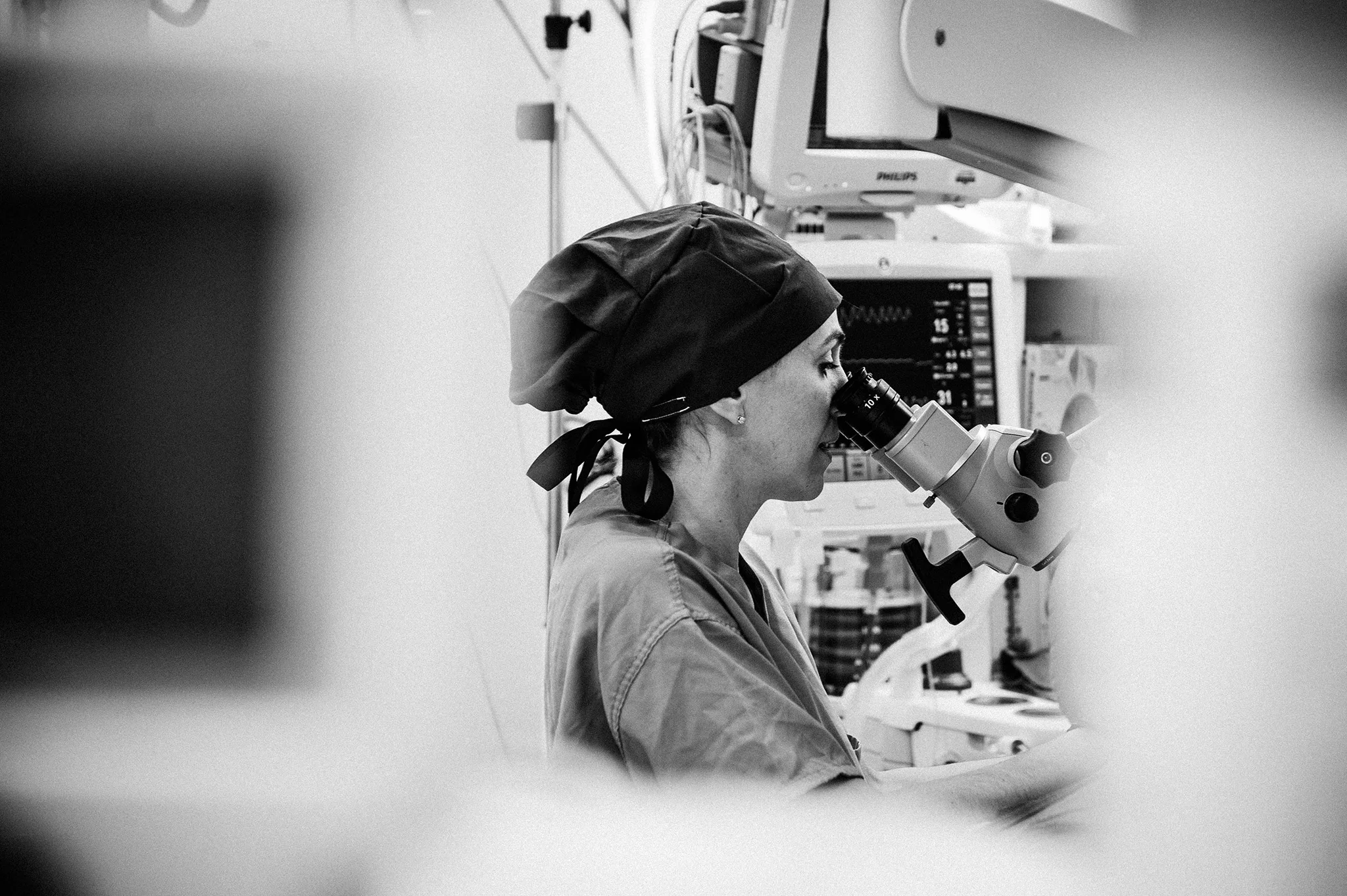 February 2: Less than 25% of surgeons are women (read: too few, as super-heroic as their male counterparts and utterly competent), and the best way I know to showcase the incredible work they do is to pay attention when I get to document them at work. Hospital lighting is hard. Black and white is my friend.