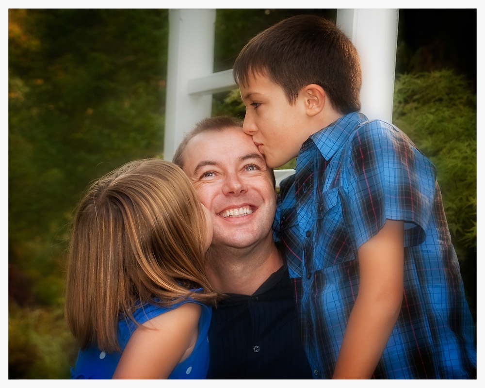 Dad and kids kiss web.jpg