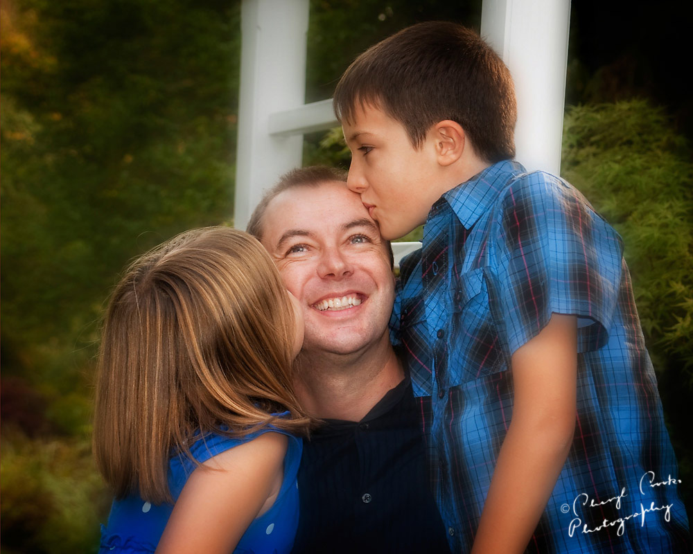Dad and kids kiss web.jpg