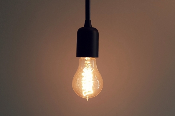 Image of a lit bulb symbolizing creative insight in design thinking.