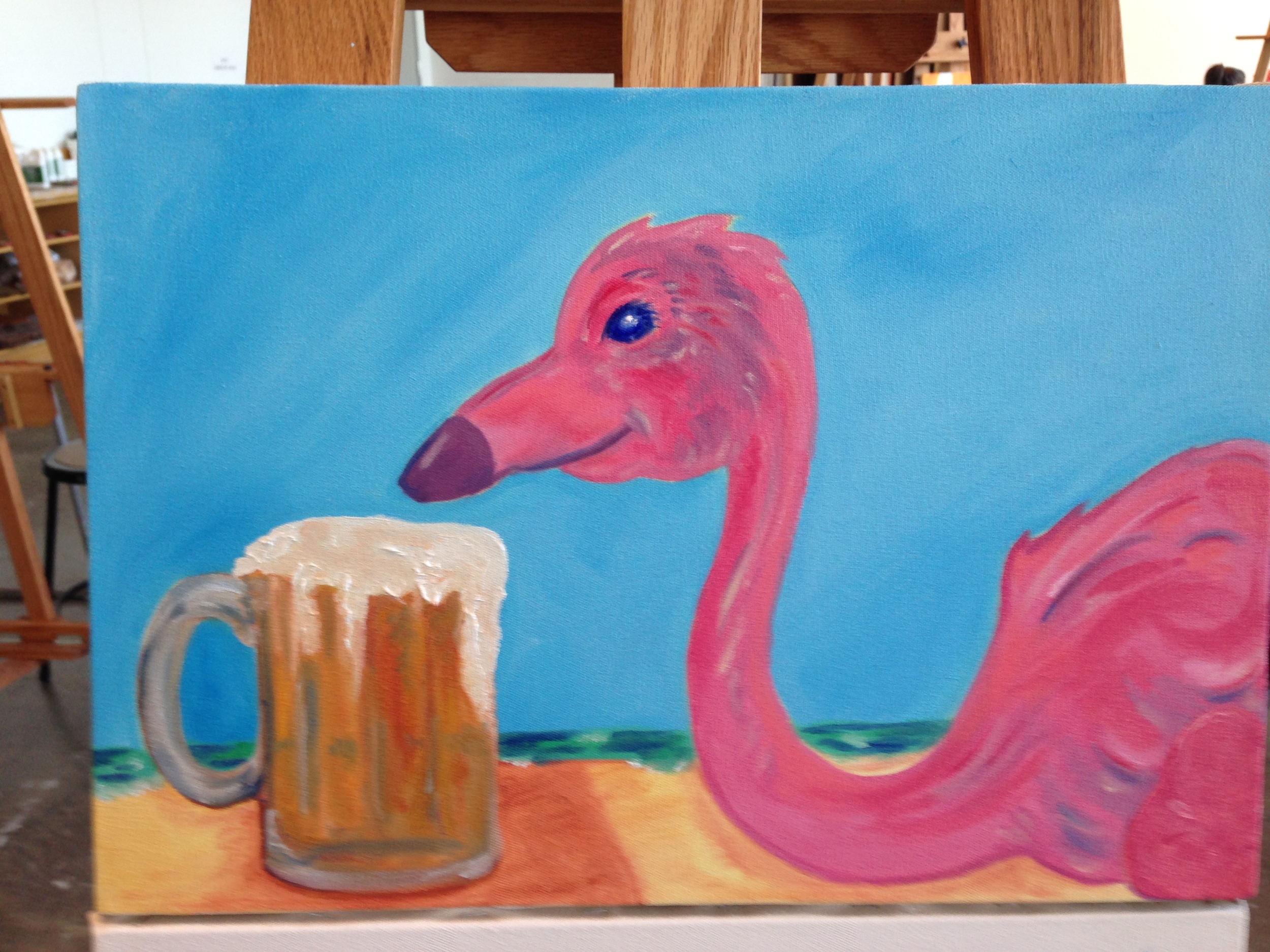 Flamingo enjoying a cold one