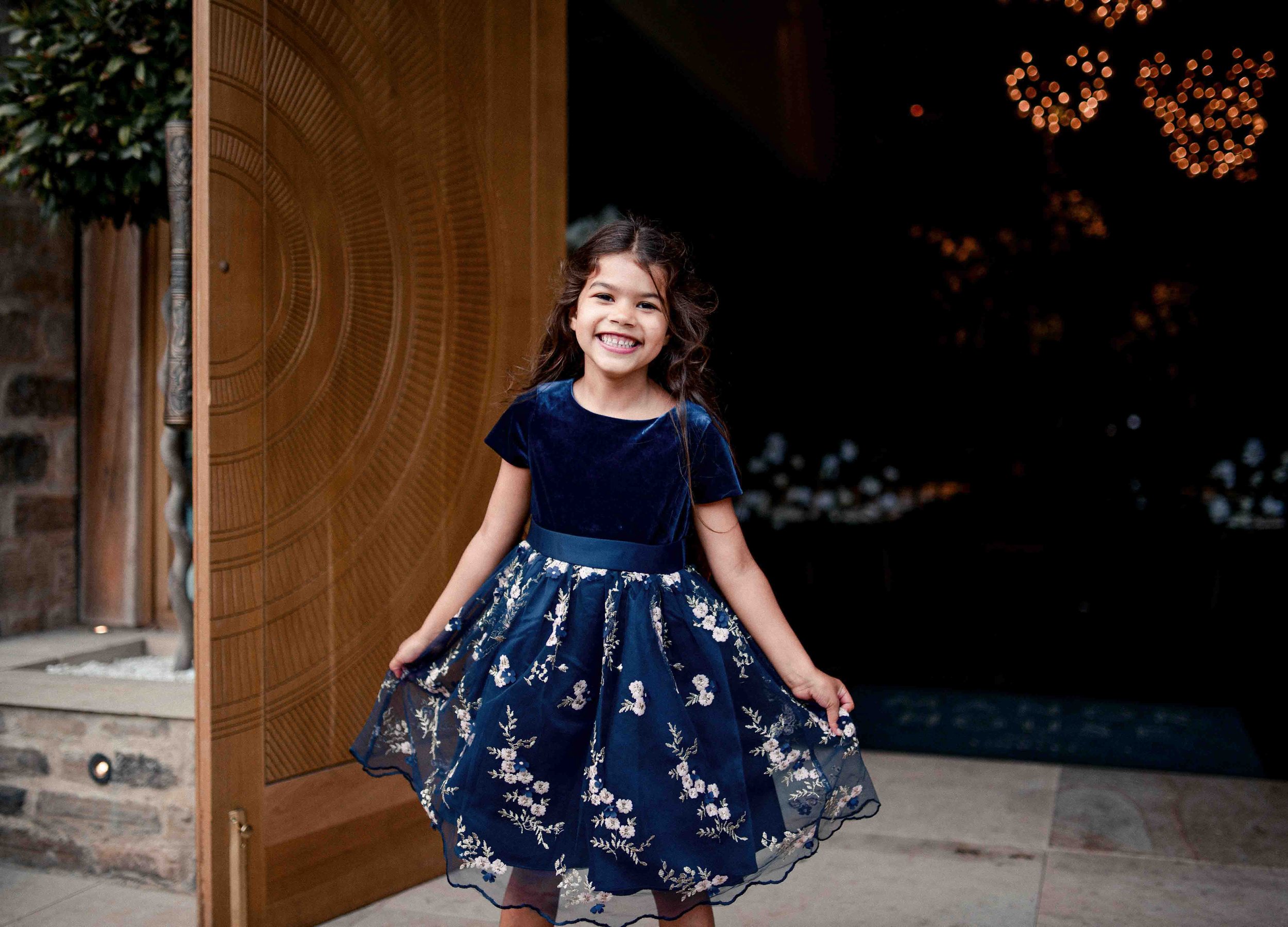 Smiling flower girl at Manor House Lindley – wedding photography by Ryan Lee Turton
