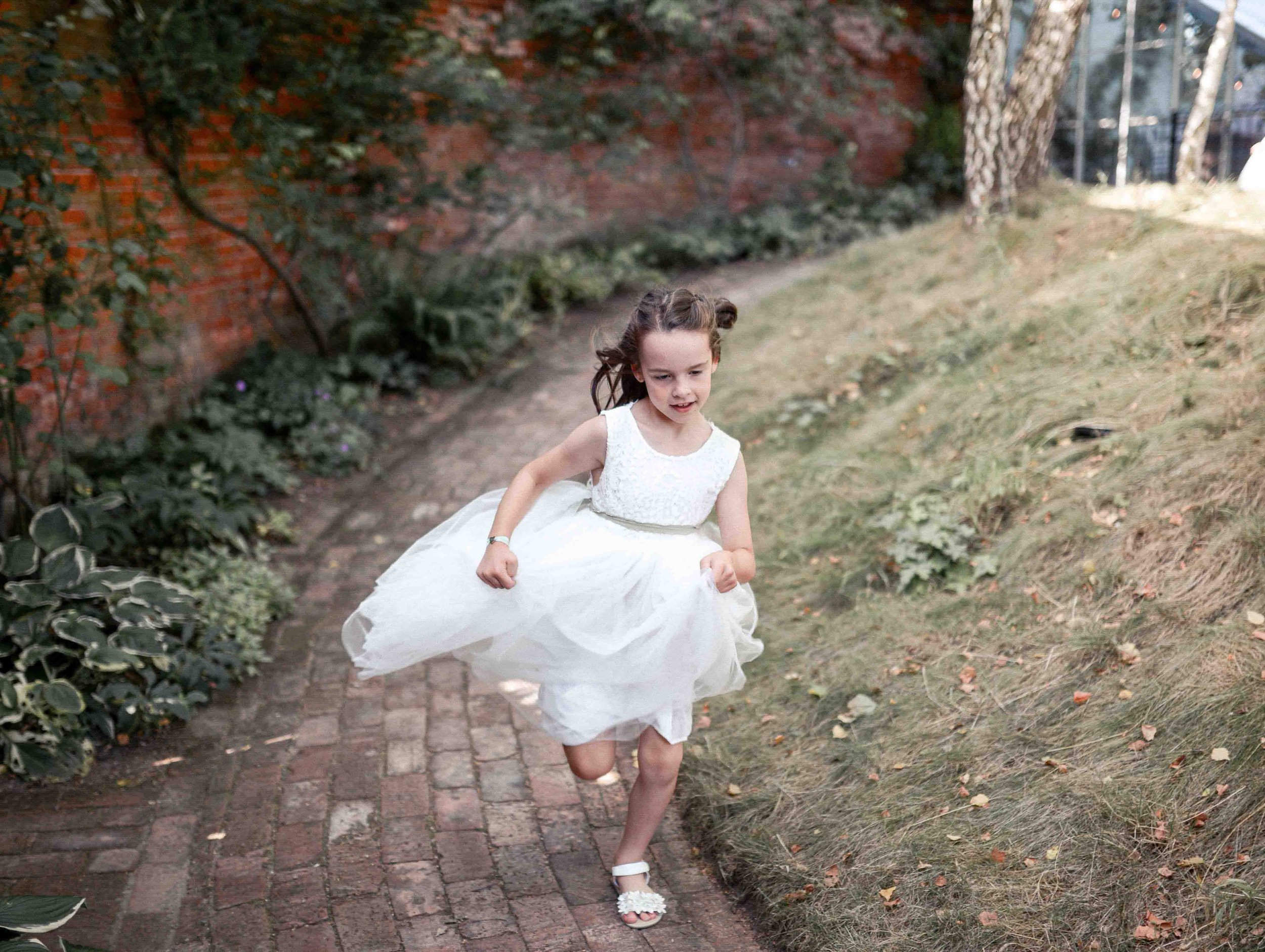 Natural candid photo of child playing – Beeston Fields wedding by Yorkshire photographer Ryan Lee Turton