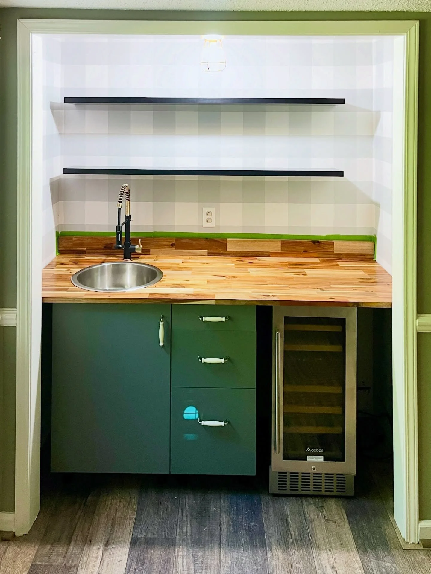 I hope you caught my previous post about the garage transformation project! In case you missed it, here are photos of how a bar went from countertop to completion. My client had started this project and it stalled, but while organizing the garage, I 