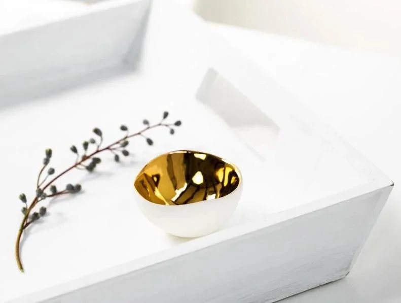 Small white porcelain and gold lustre bowl on a tray by Penny Little