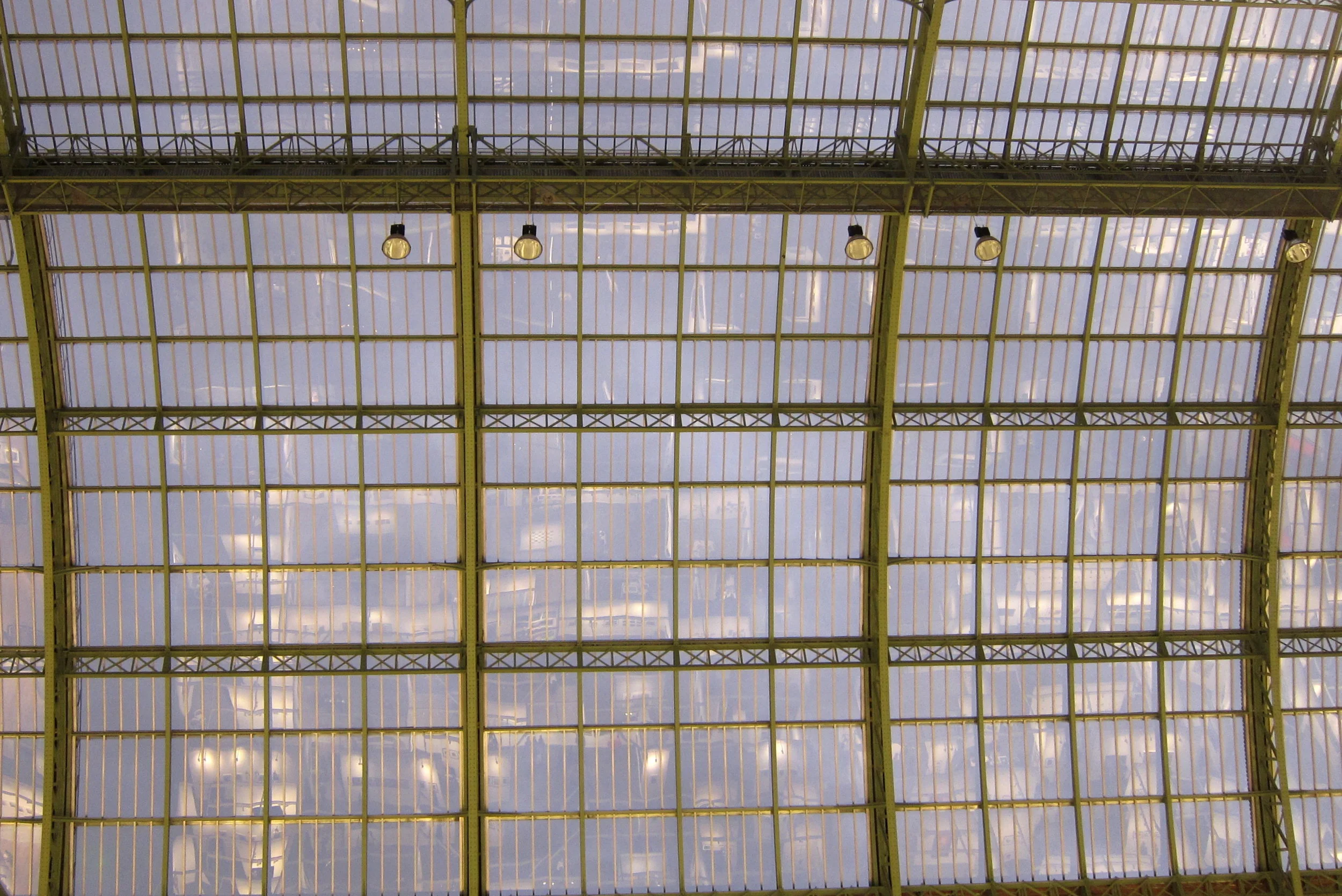 The glass ceiling of the Grand Palais reflects the stalls below. If I'd had a tilt-shift lens maybe I could have corrected the perspective distortion evident here. But I didn't, because I don't own one. Ditto a gold-plated handgun.