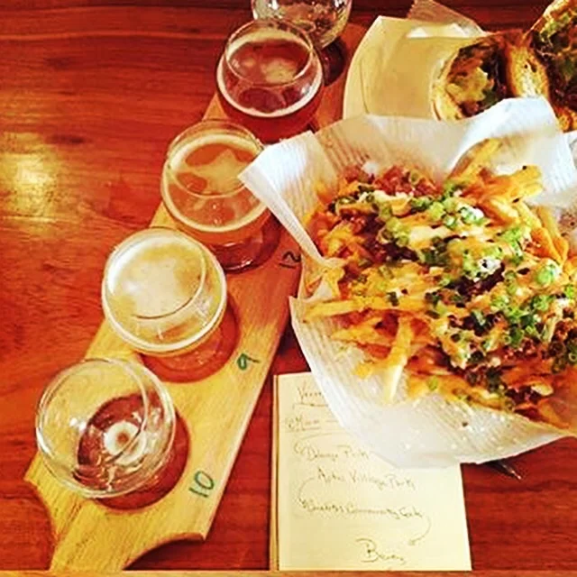 A perfect Pairing. Naughty Fries , Philly Cheese Steak and a Beer Flight from Corralitos Brewing Co. A ohoto posted by newly engaged couple doingtastings.
